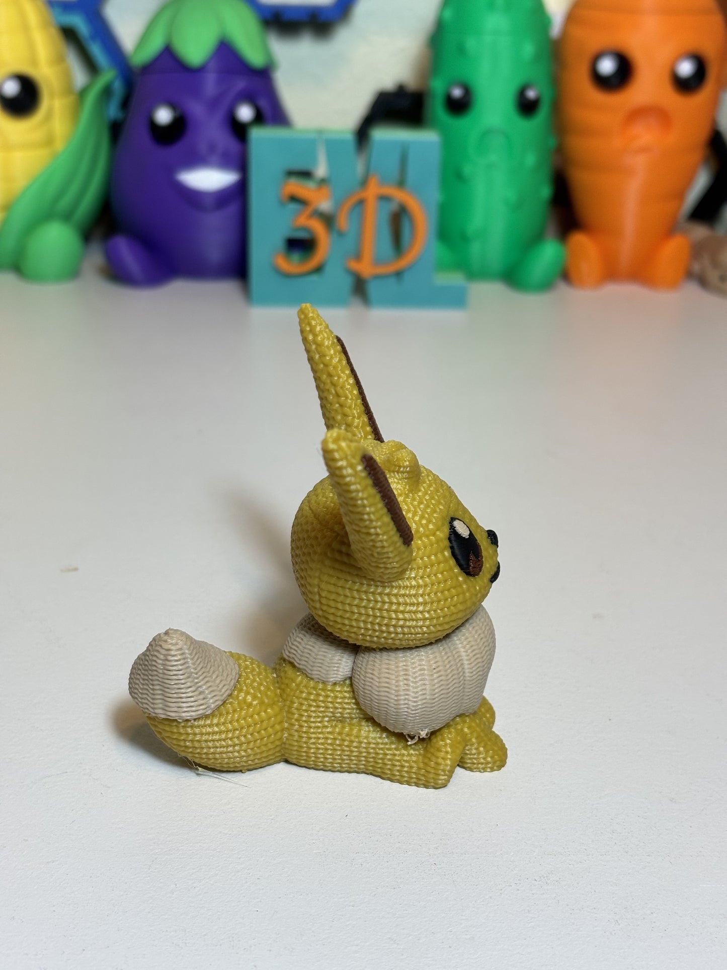 Top-down view of 3D printed Eevee figure faux knit texture finish