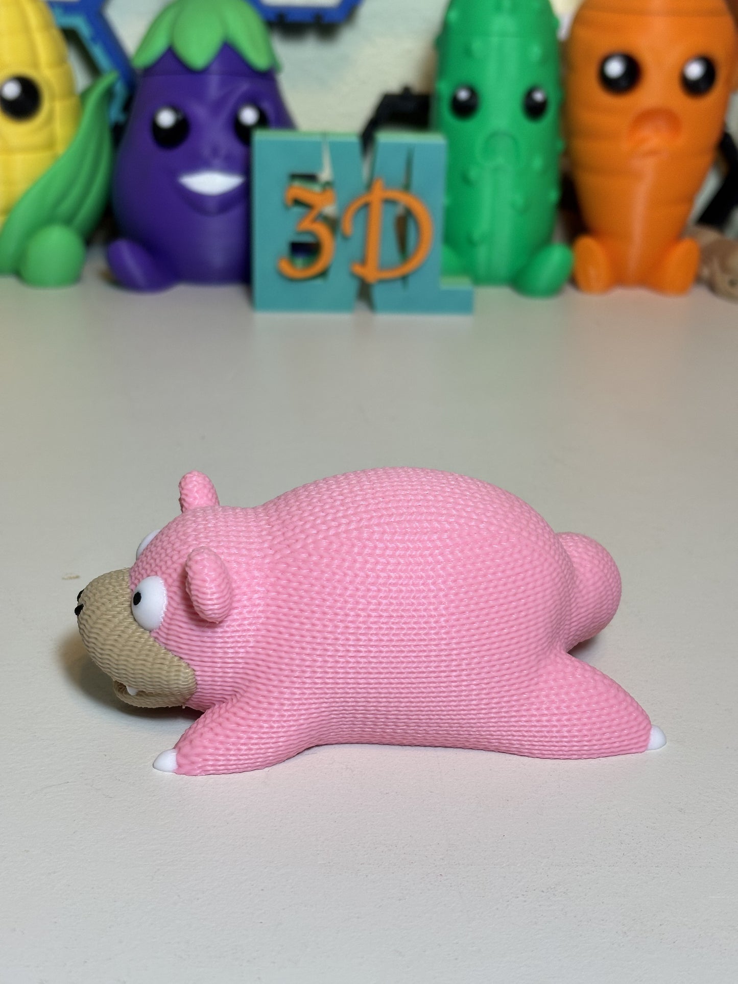 Top-down view of 3D printed SlowPoke figure showing full knit texture