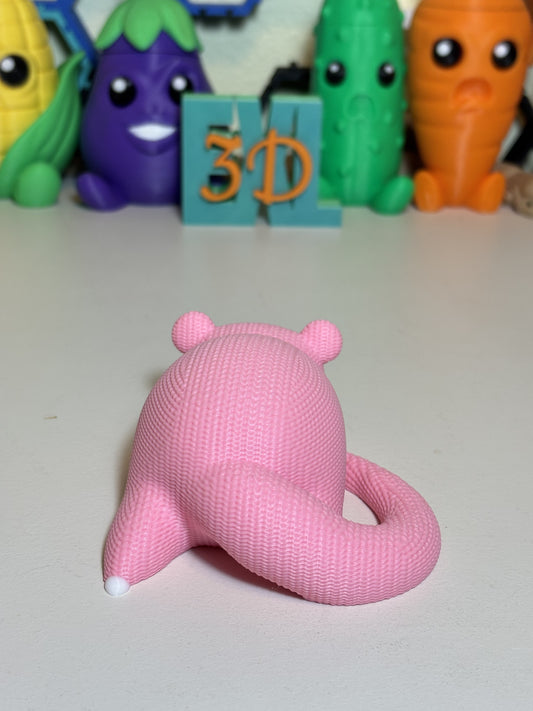 Close-up of faux knit texture detail on SlowPoke figurine figure