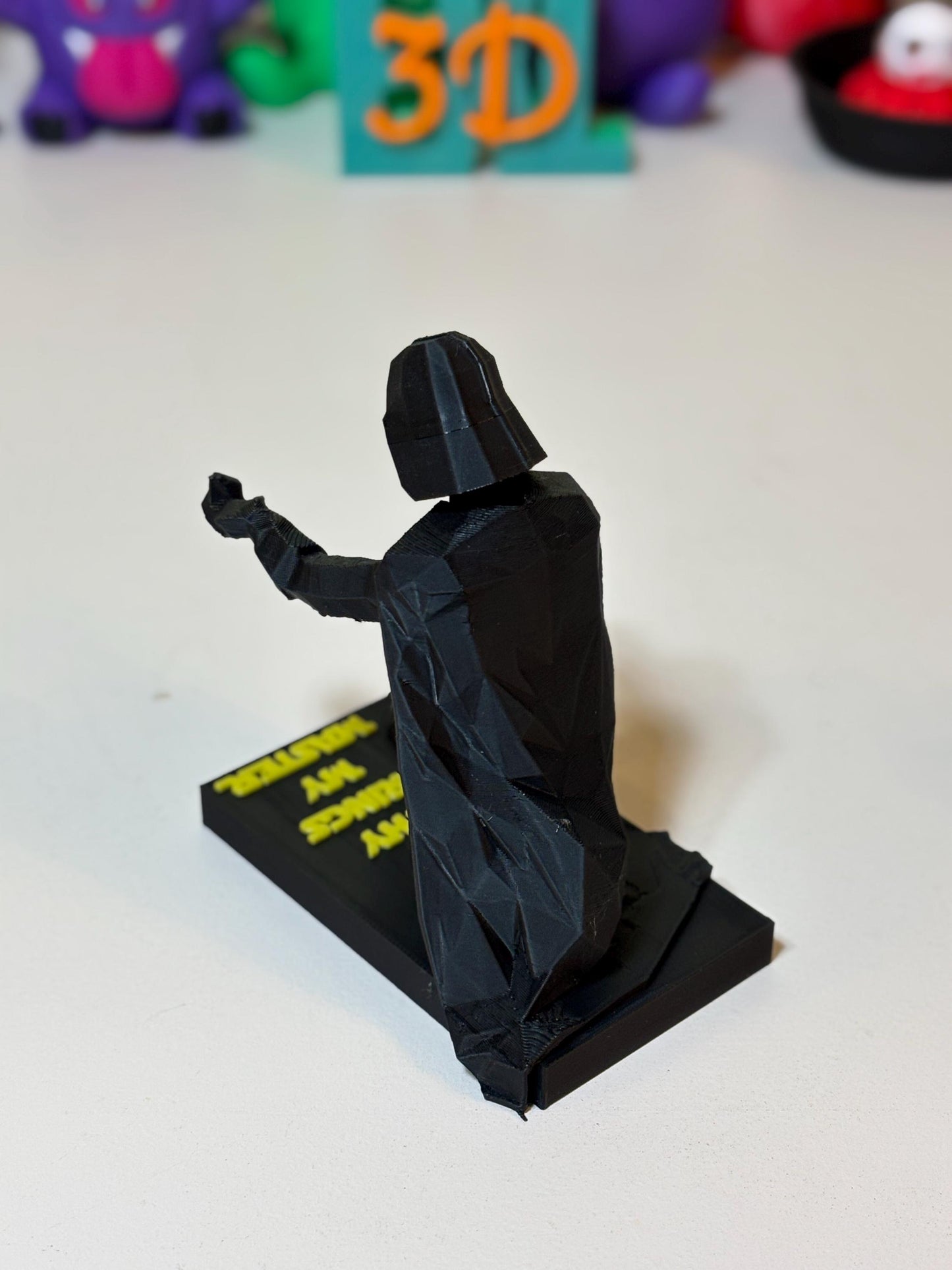Front view of matte black low poly Vader statue with no base text option