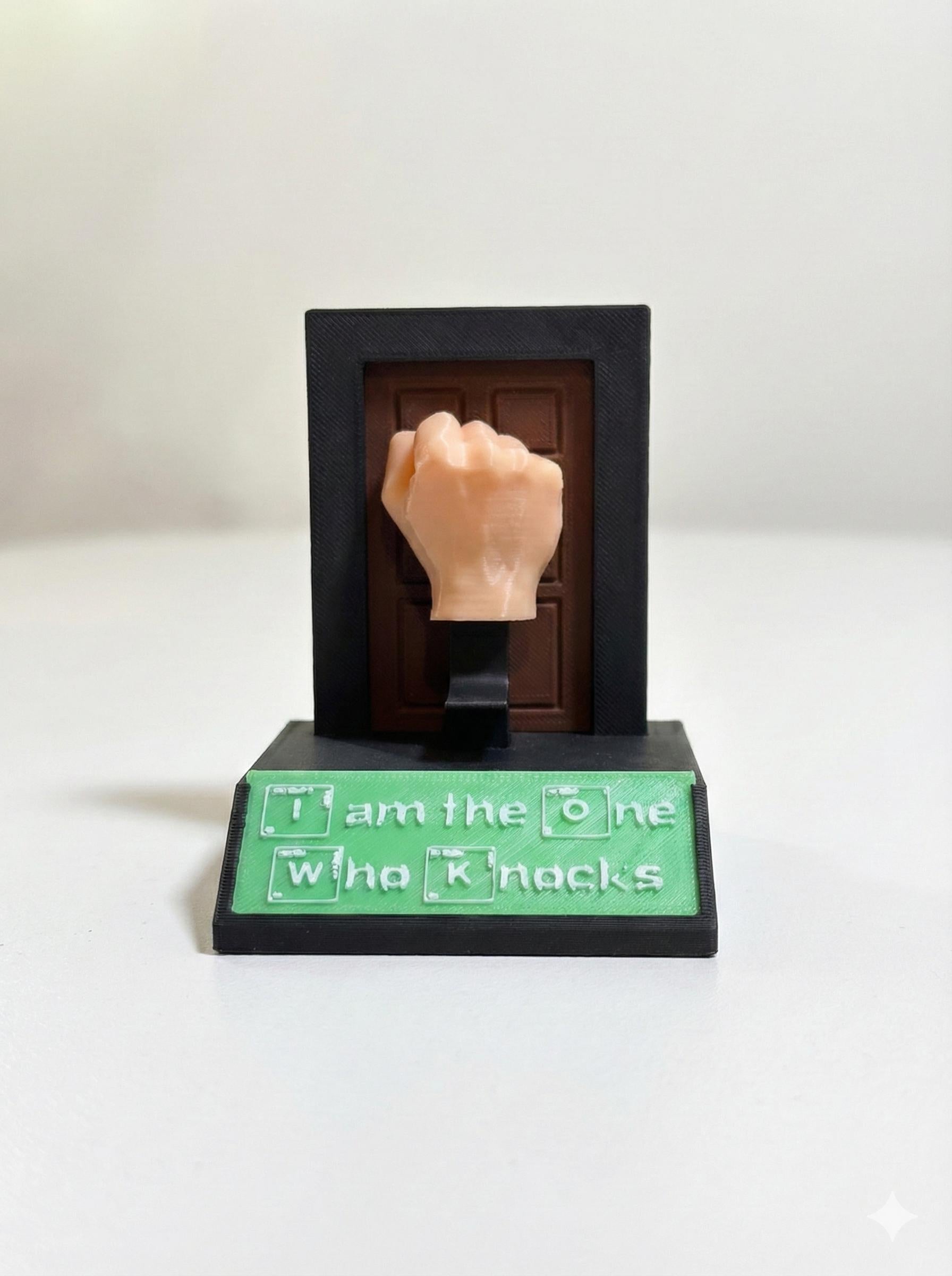 Close-up of periodic table sign plate on matte black desk toy base