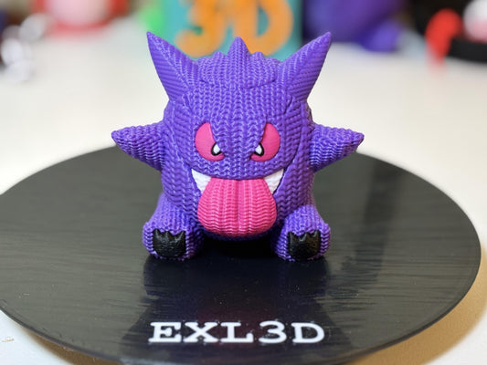 Purple faux knit ghost 3D printed figure on gamer desk shelf