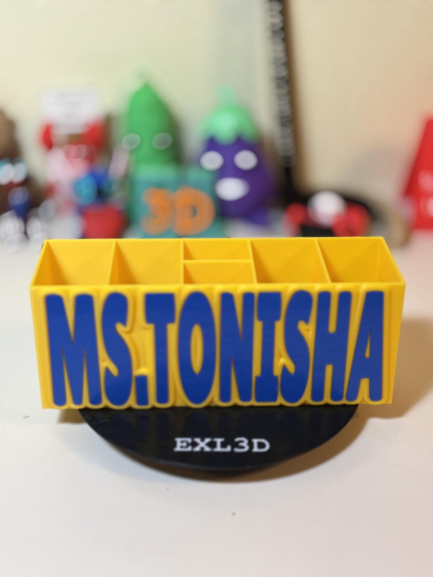 Close-up of holographic letter finish catching light on custom name organizer