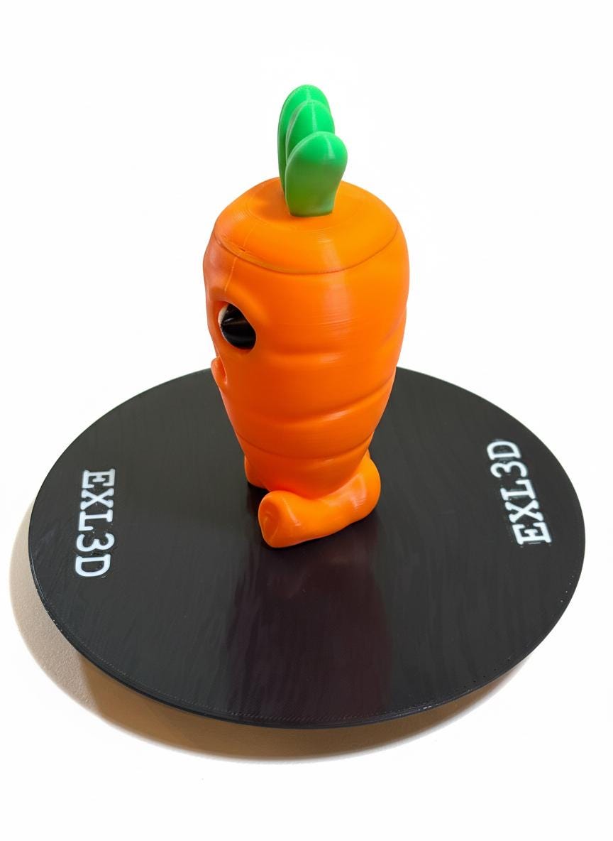 Close-up of grumpy face detail on orange PLA 3D printed carrot secret storage statue