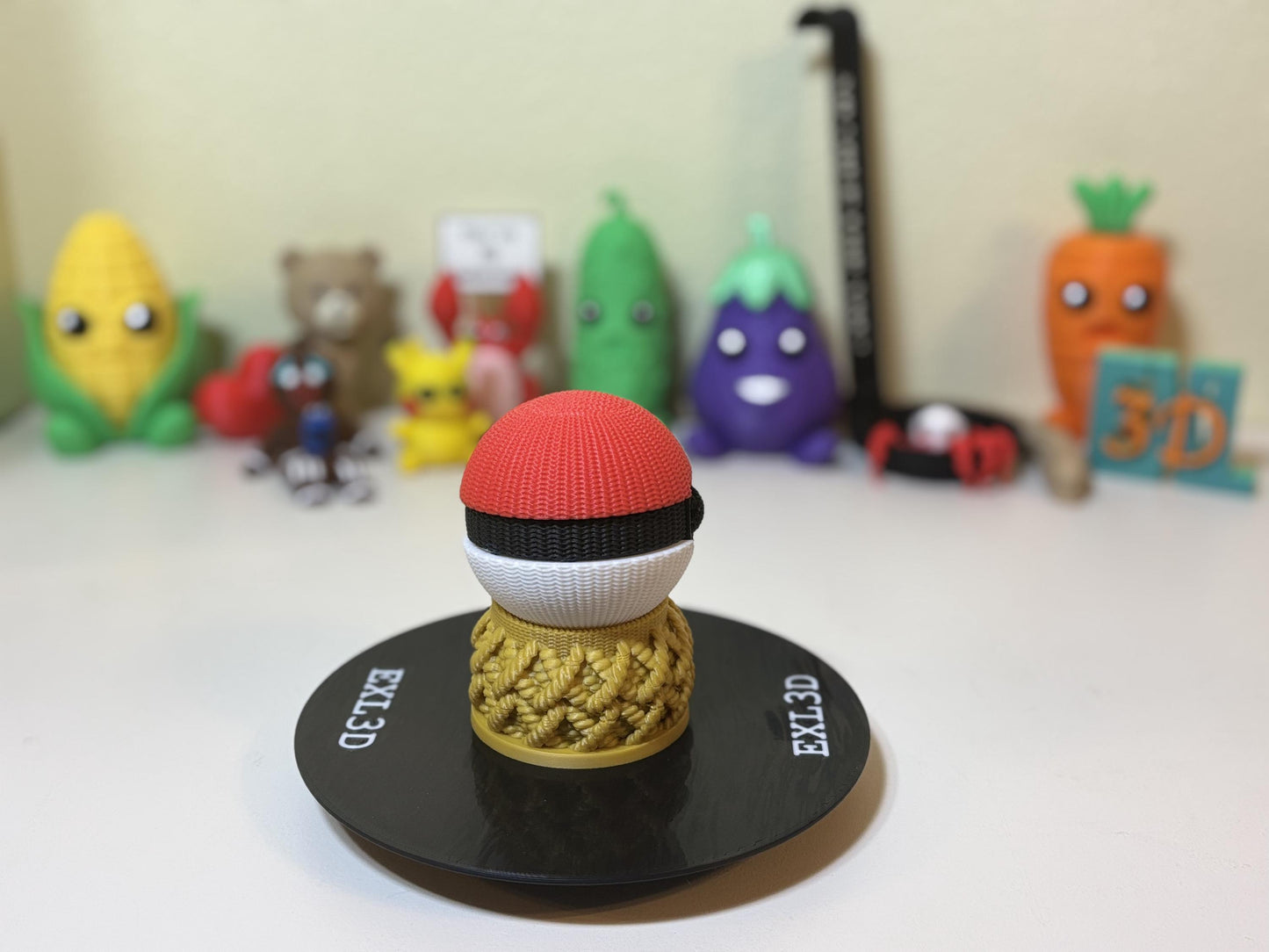 3D printed pocket ball next to anime shelf decor and figurines