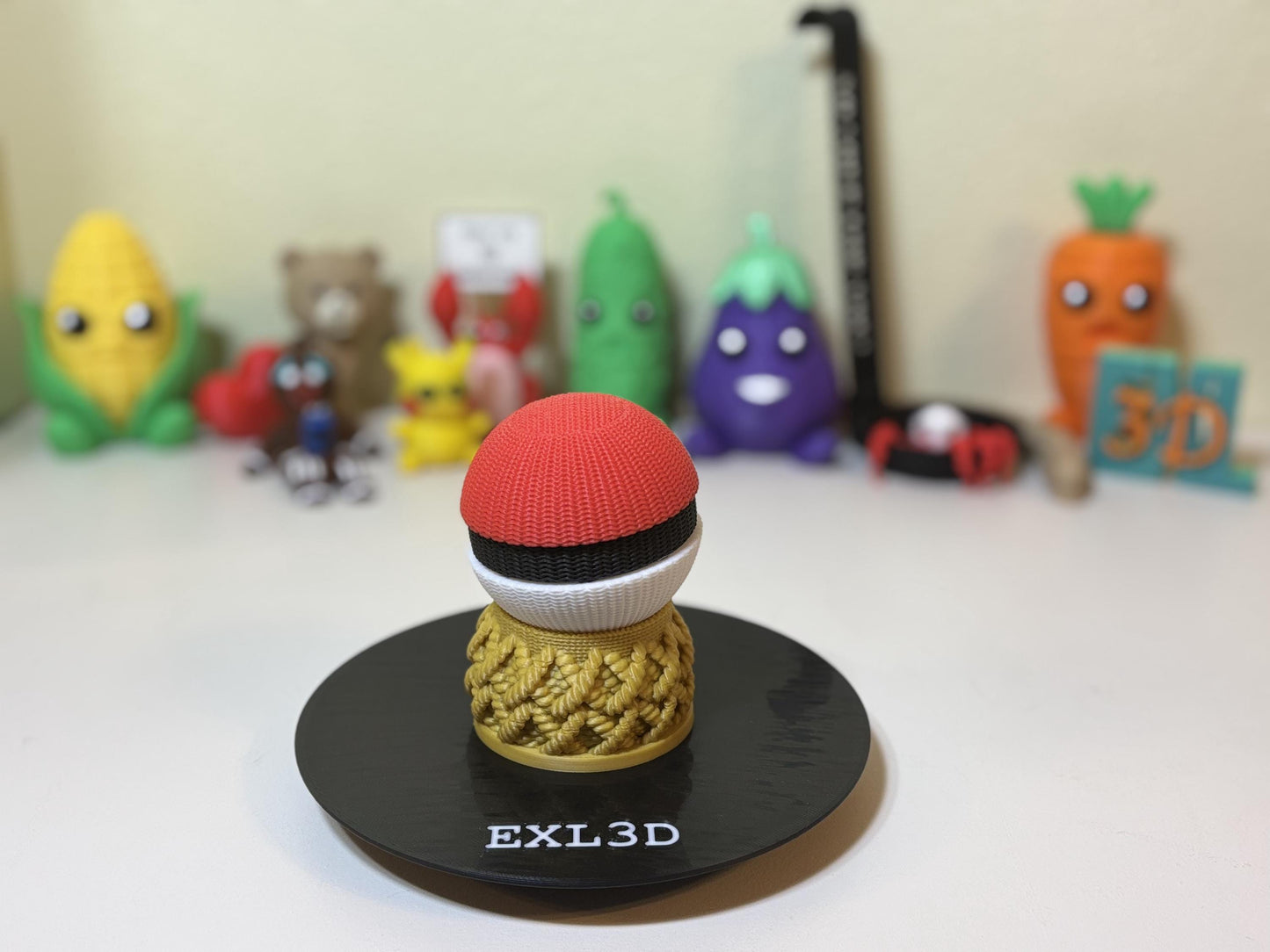 Faux knit pocket ball displayed on gold braided 3D printed stand