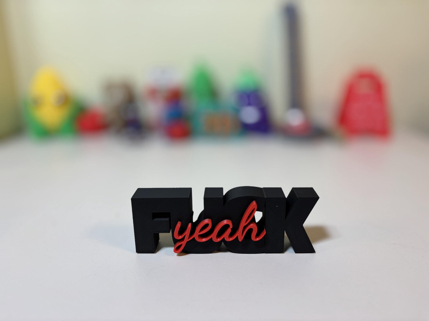 Colorful custom F-word signs arranged together showing multiple word and color options