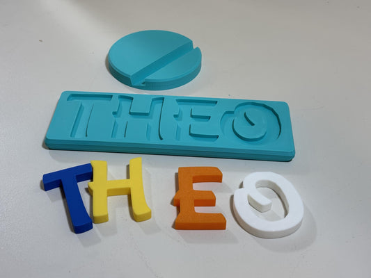 Personalized 3D printed name puzzle with colorful chunky letters on white background