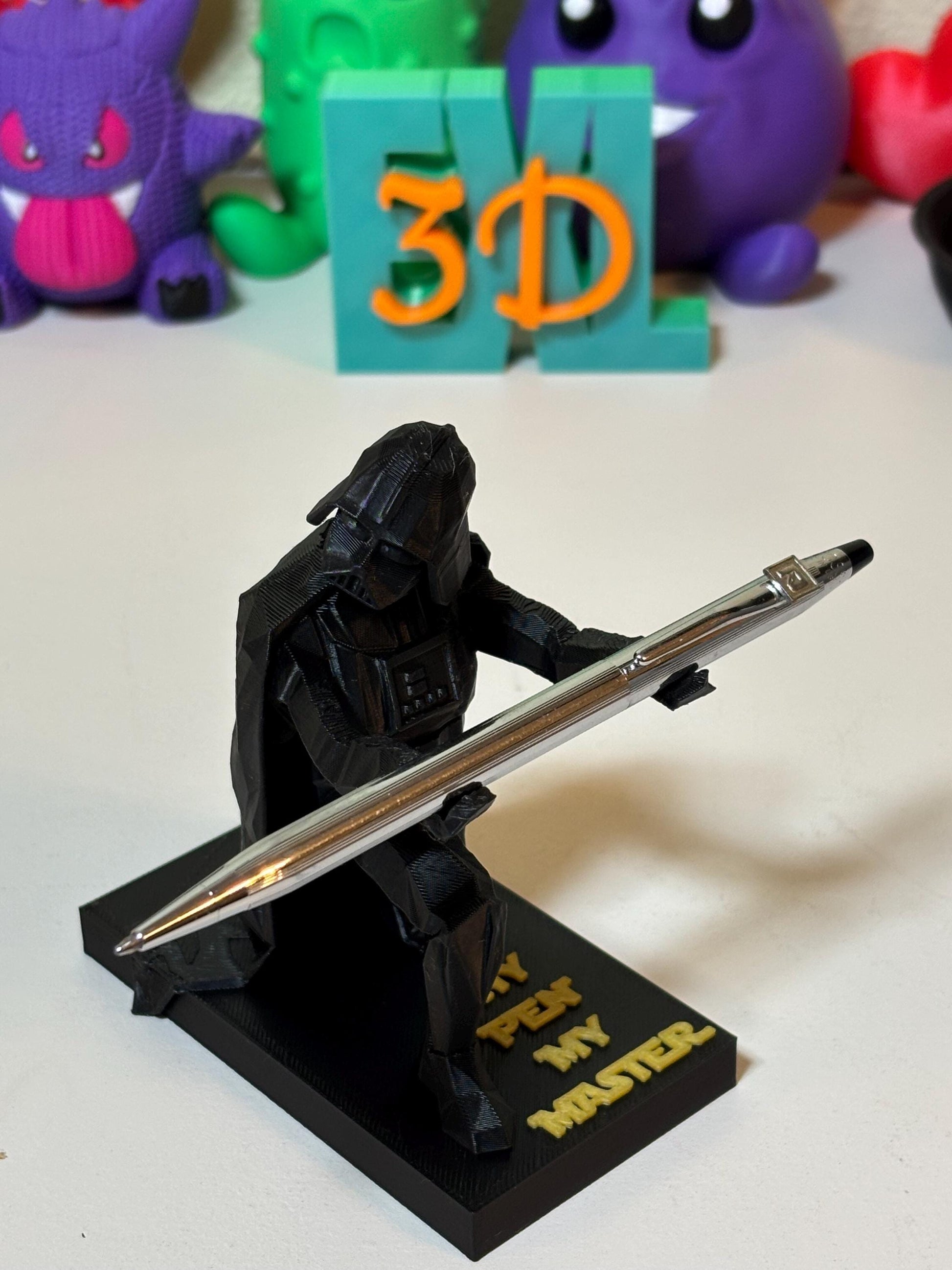 Custom base text close-up on low poly Vader figure showing engraved lettering detail