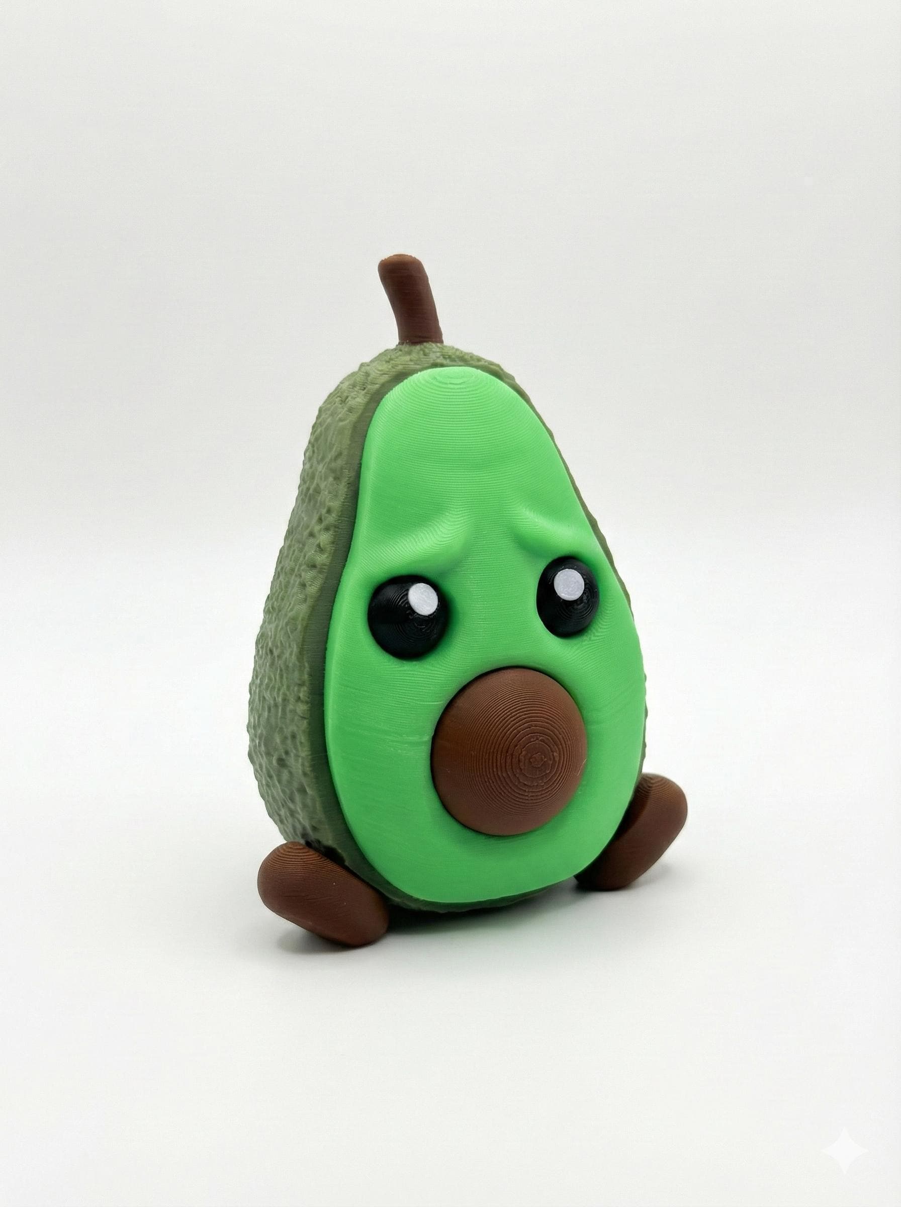 3D printed anxious avocado stash box with removable face on white desk