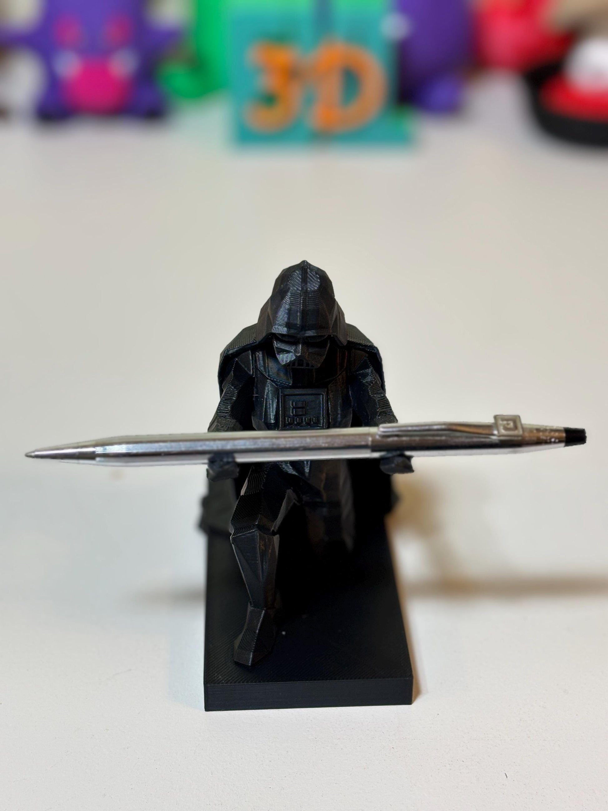 Side angle of low poly Sith Lord desk sculpture showing 4.5 inch height profile