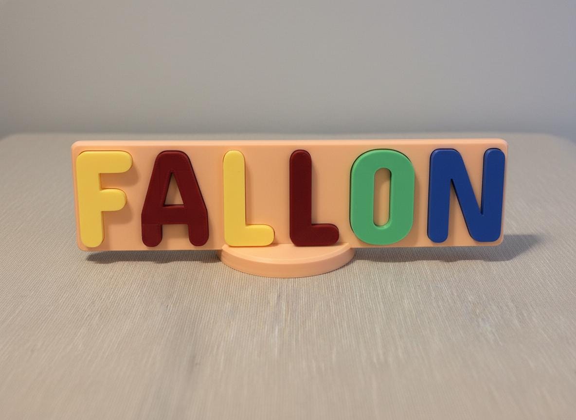Side angle of 3D printed name puzzle showing half-inch thick letter and base depth