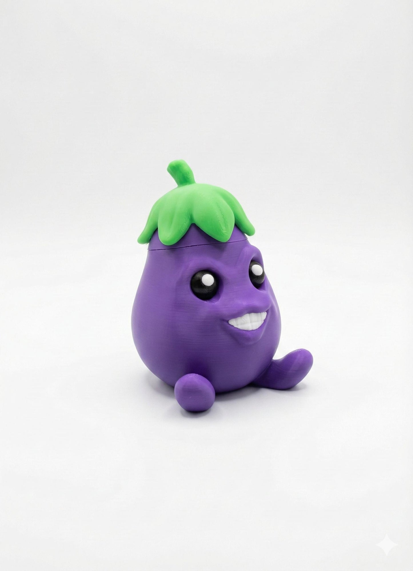 Eager Eggplant secret storage figurine on desk with wide eyes and cheeky grin front view