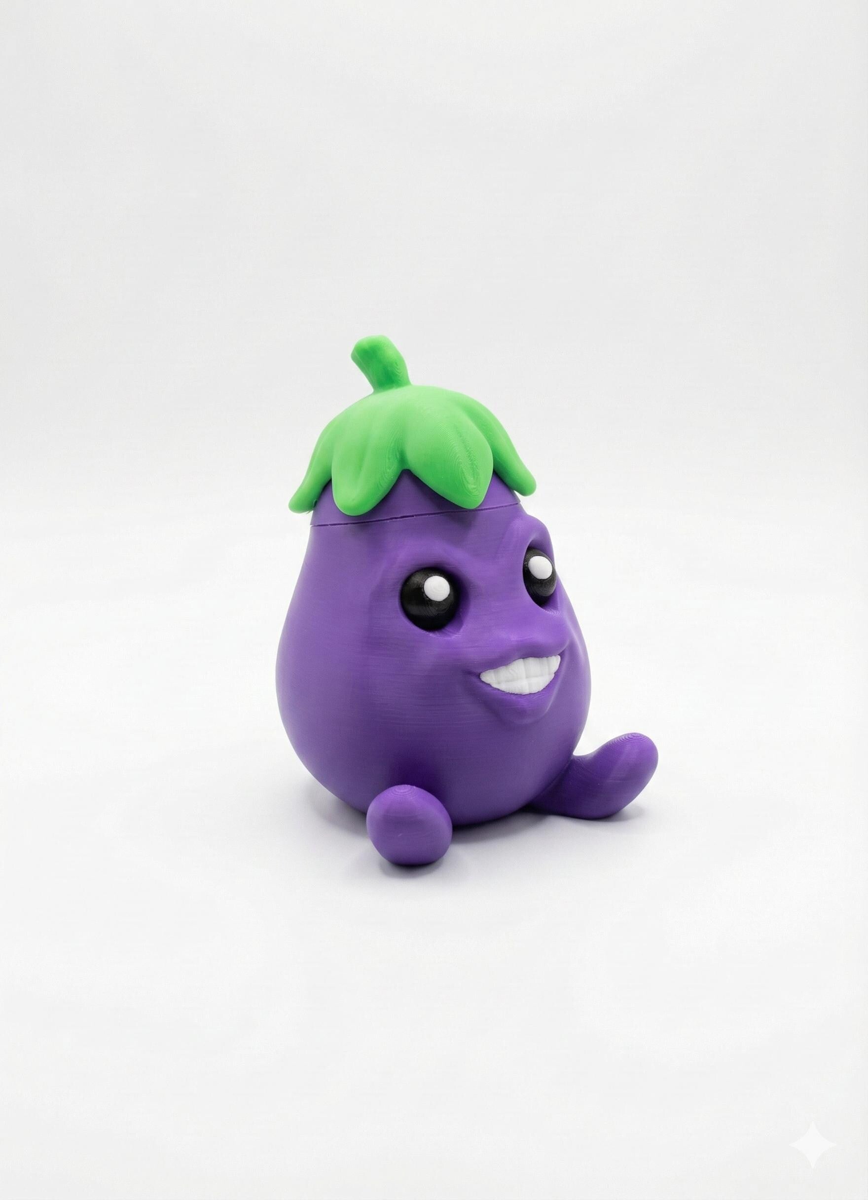 Eager Eggplant secret storage figurine on desk with wide eyes and cheeky grin front view