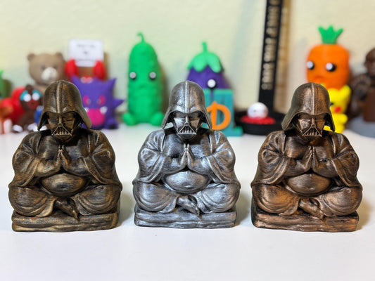 3D printed Zen Buddha Darth Vader statue in gold metallic finish on black