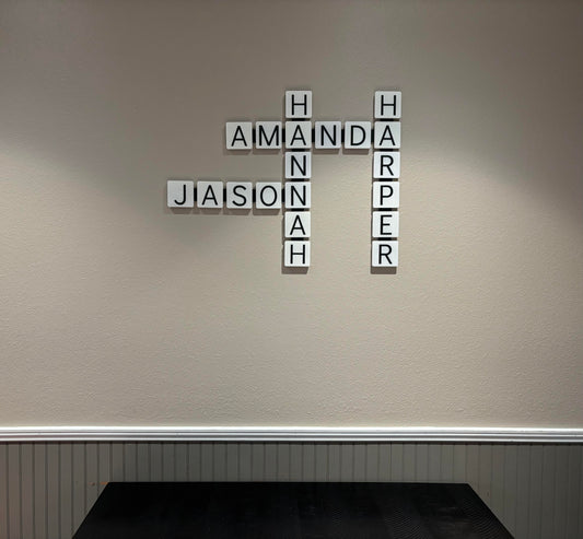Bold orange 3D printed wall tiles arranged as personalized word display