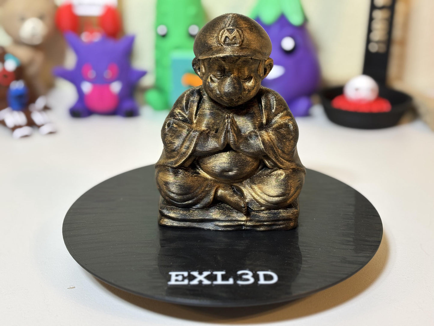 Close-up of hand-painted gold finish on zen plumber Buddha figurine