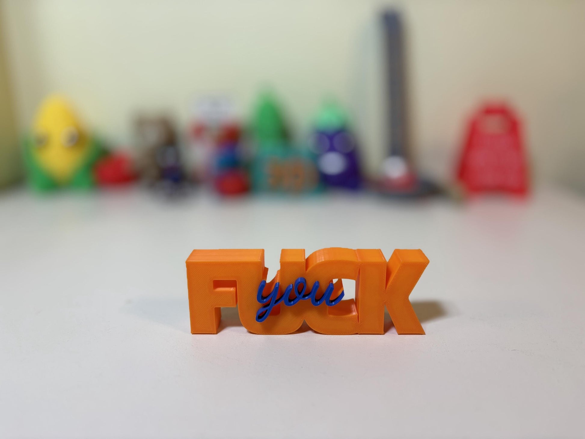 F-word sign size comparison showing 5.5 inch and 7 inch versions side by side
