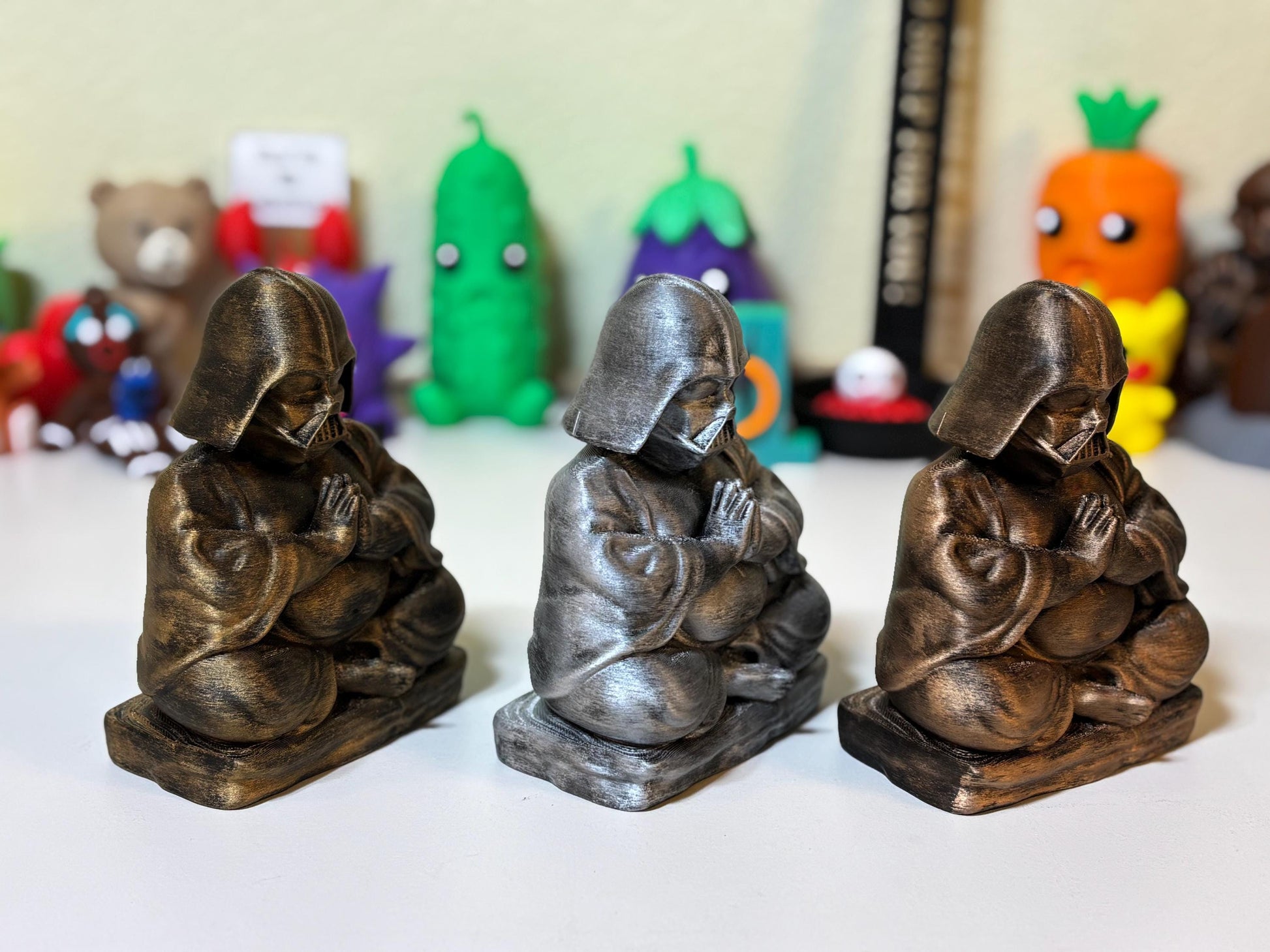 Close-up of hand-painted gold metallic detail on 3D printed dark lord Buddha statue