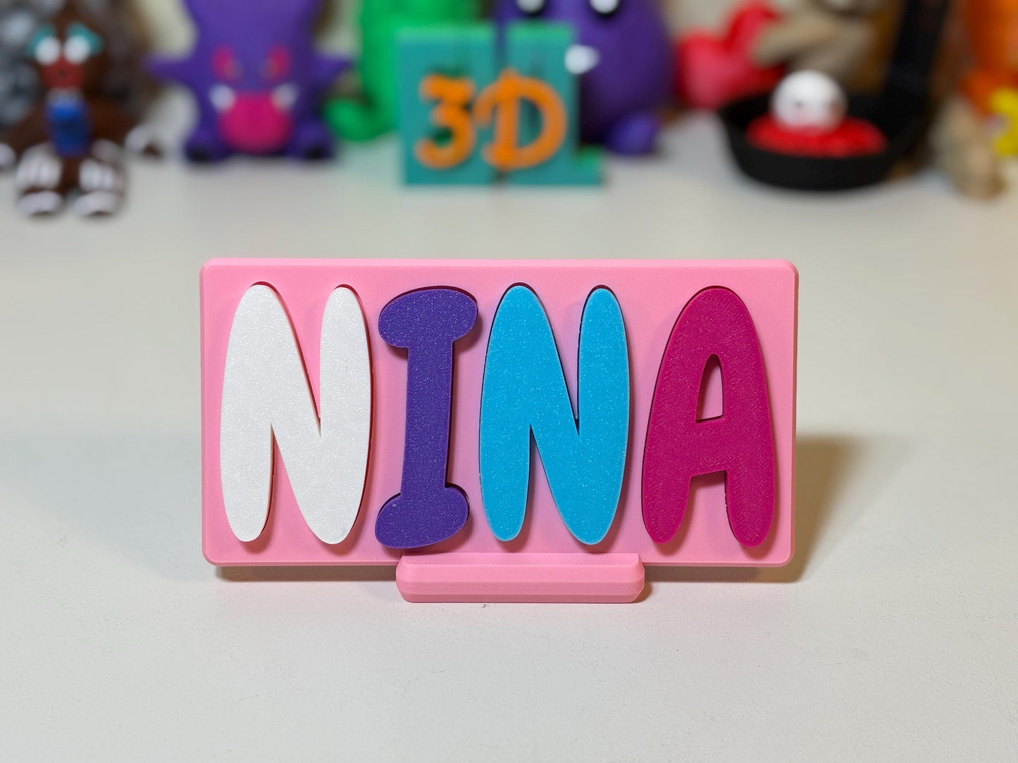 Bubblegum font name puzzle laid flat showing shaped letter slots in base