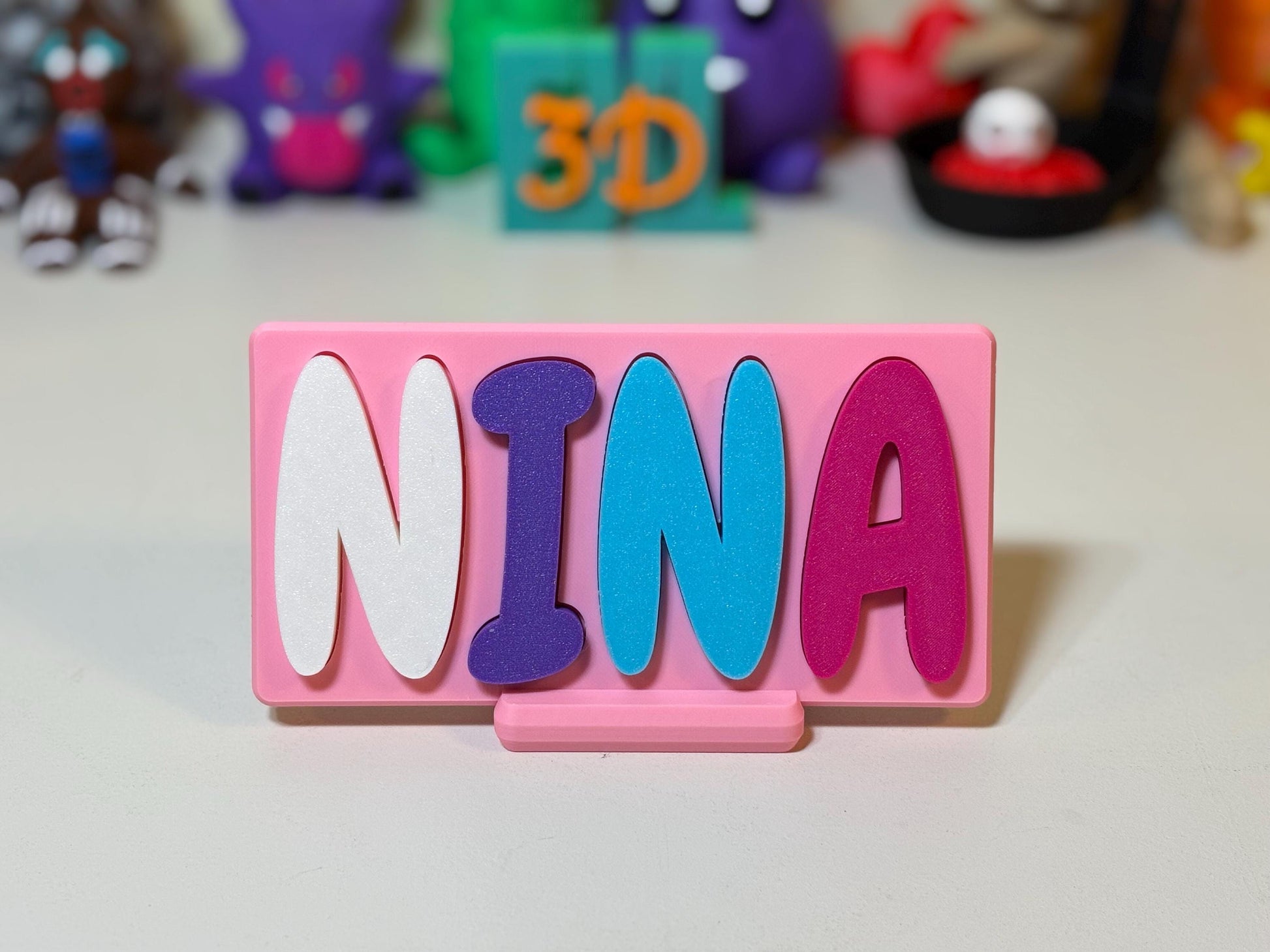 Bubblegum font name puzzle laid flat showing shaped letter slots in base