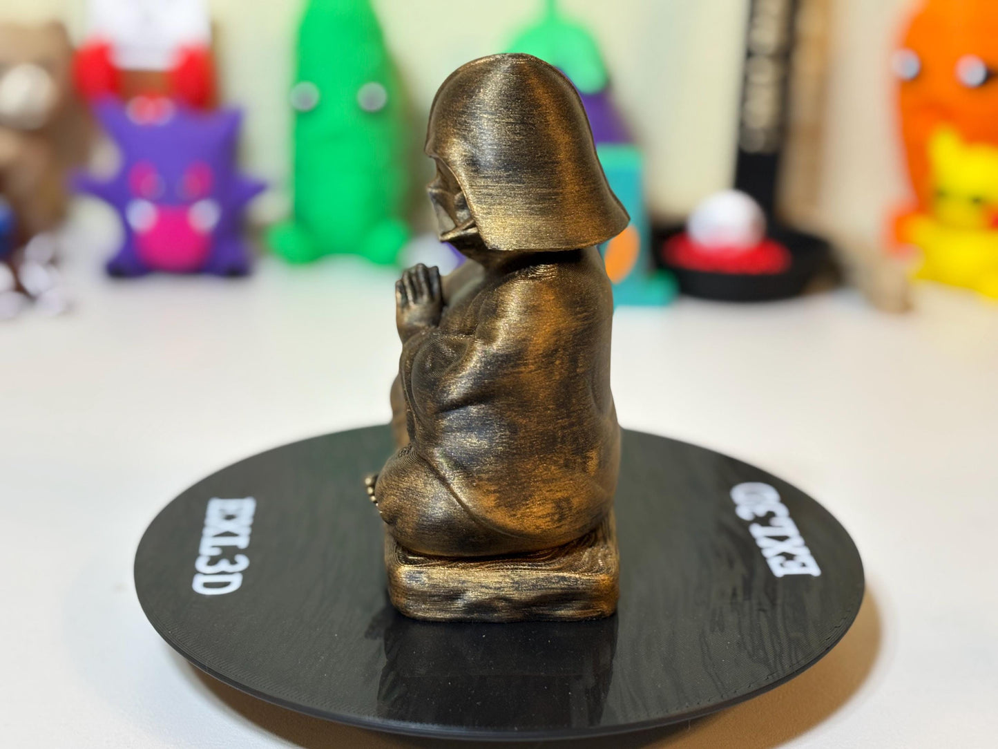 Side angle view of 3D printed Zen Buddha dark lord statue showing sculpted robe detail