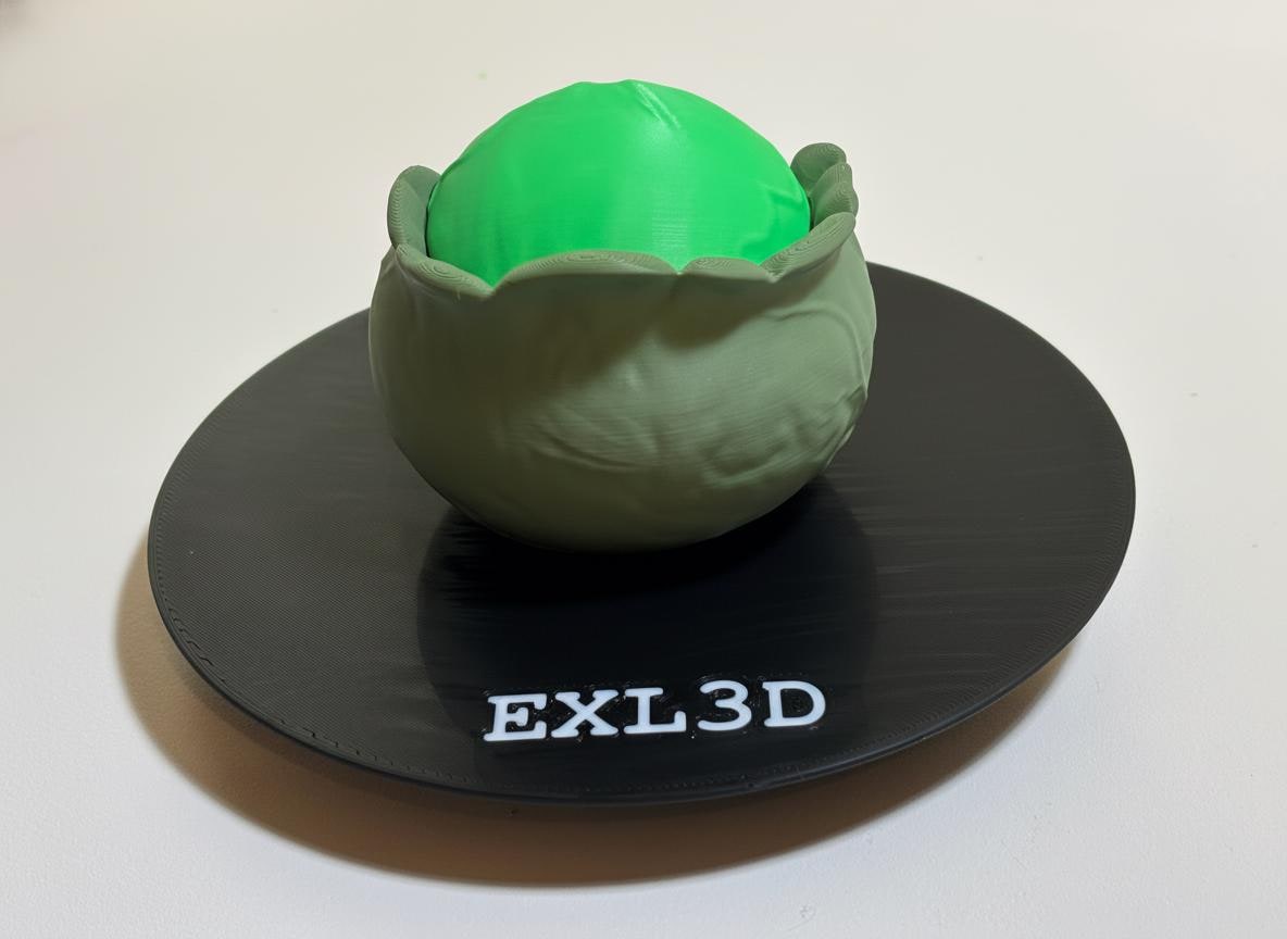 Side angle of 3D printed cabbage figurine showing seamless hidden compartment seam