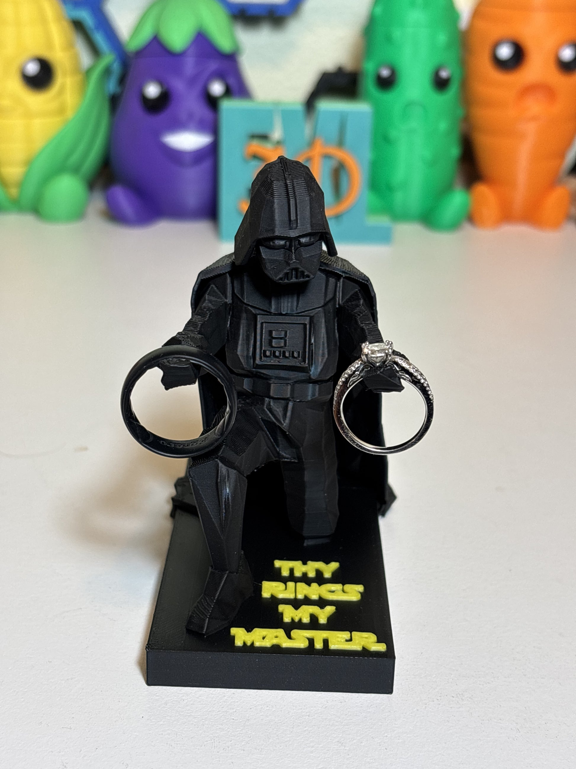 3D printed pop culture desk decor Vader figure in moody dark workspace setup