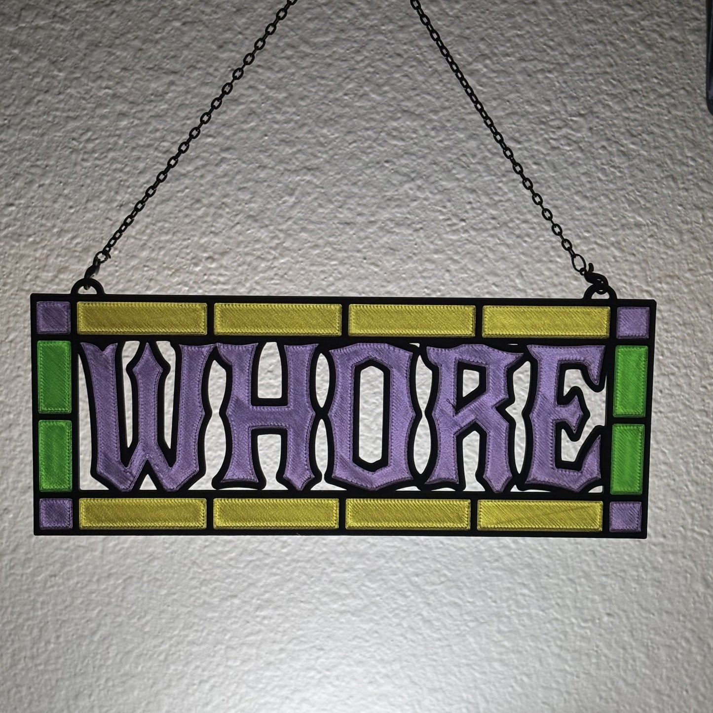 Overhead flat lay of all four suncatcher color themes on light neutral surface