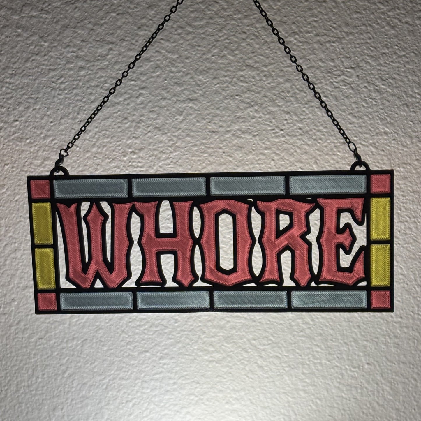 Custom 3D printed suncatcher gift wrapped for presentation on wooden surface
