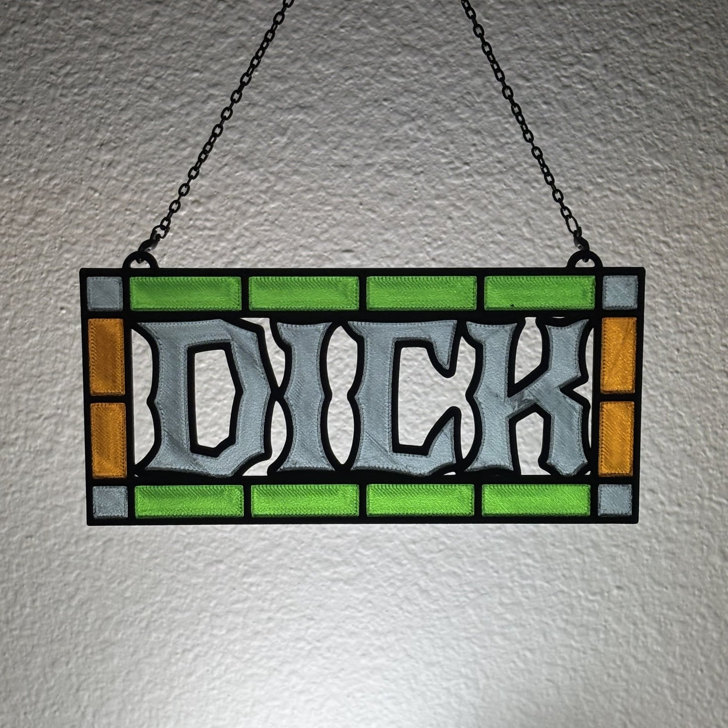 Spicy suncatcher hanging in sunlit chapel style arch window aesthetic setting