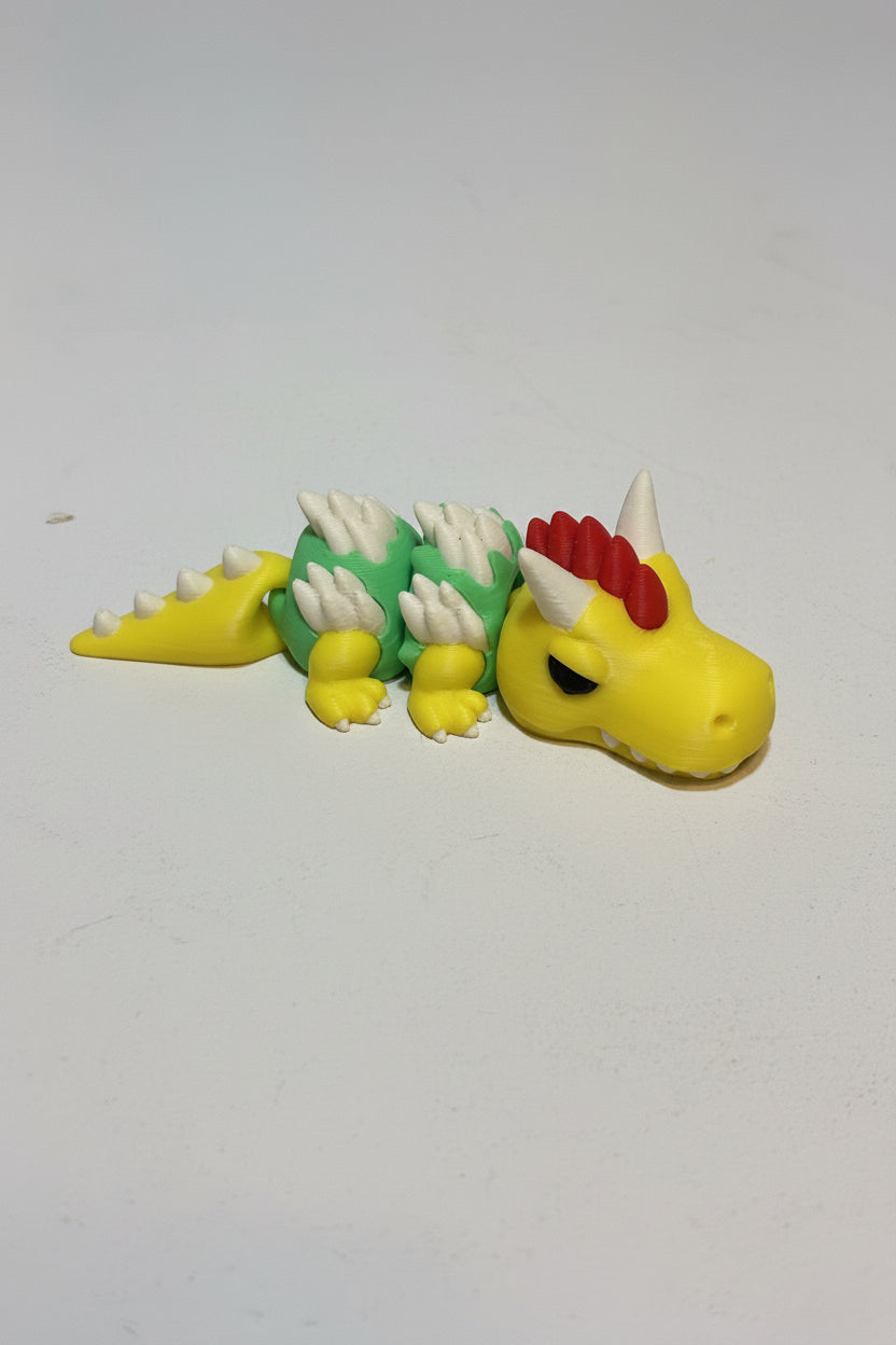 Toy bowser dragon figure on a plain background