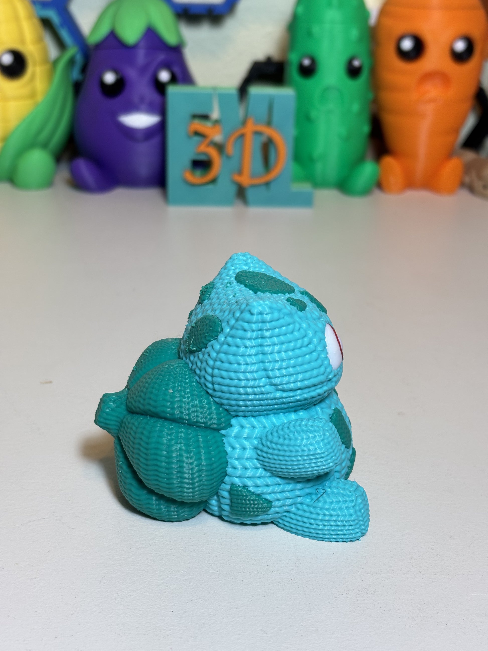 Close-up of textured faux knit finish on 3D printed Bulbasaur figure