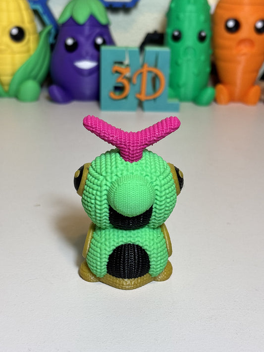 Close-up of textured faux knit finish on green Caterpie statue figurine