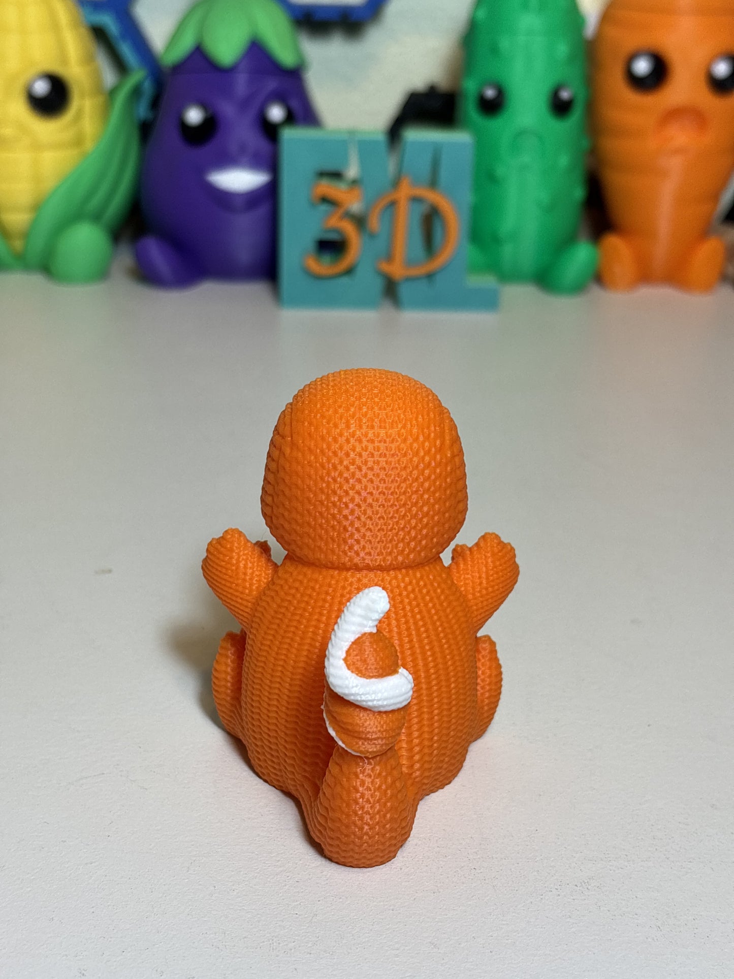 Charmander faux knit figure styled as gamer gift on shelf display
