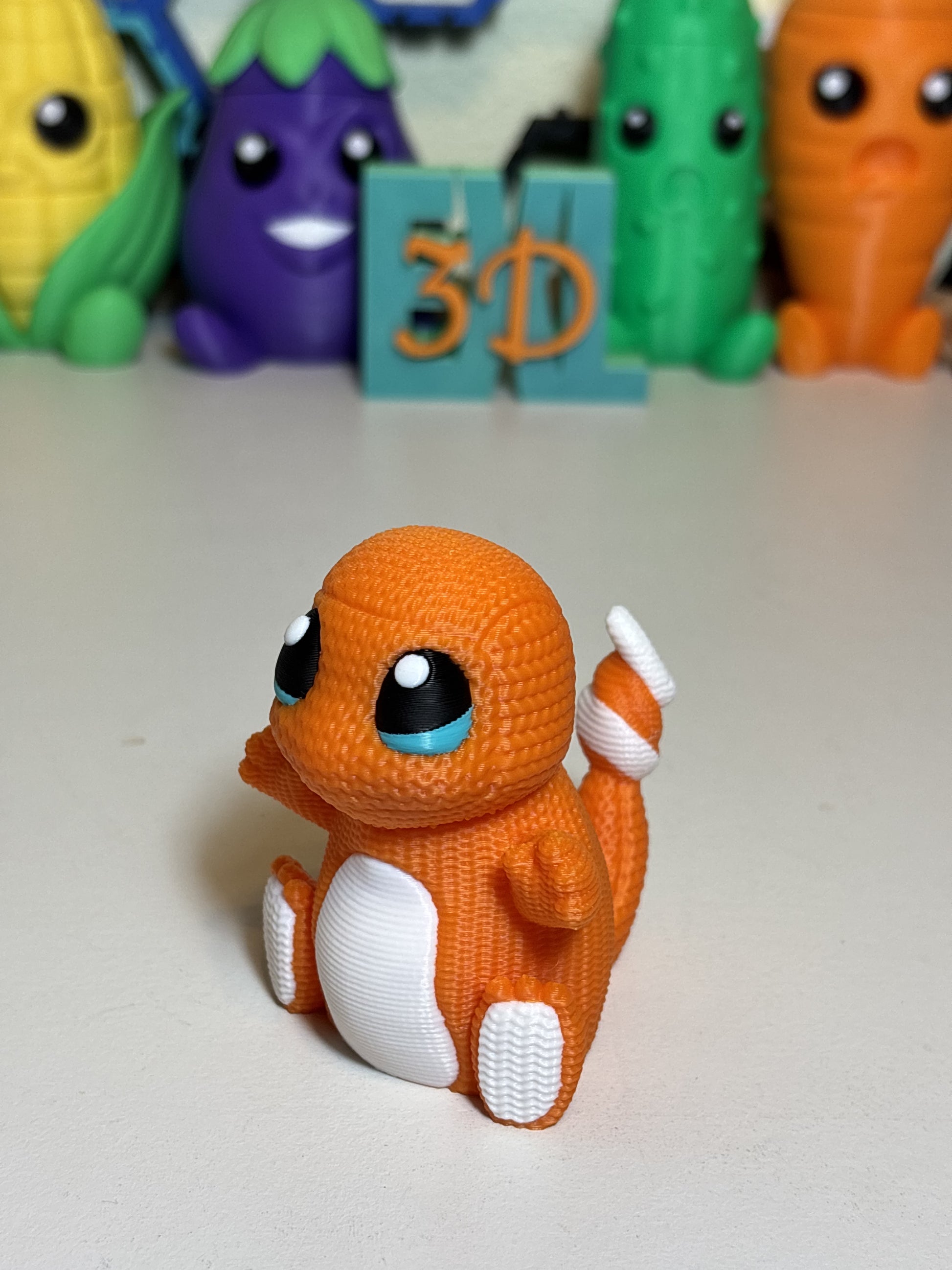 Faux knit Charmander 3D printed decorative statue on wooden desk