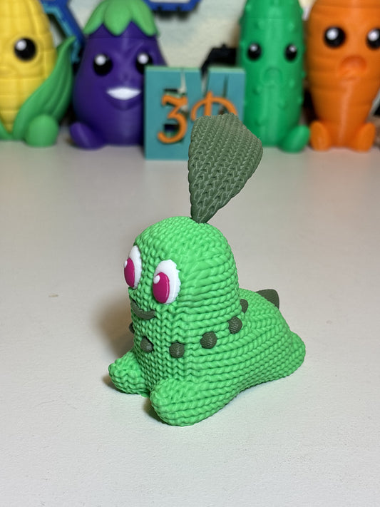 Faux knit texture 3D printed Chikorita figure on white background