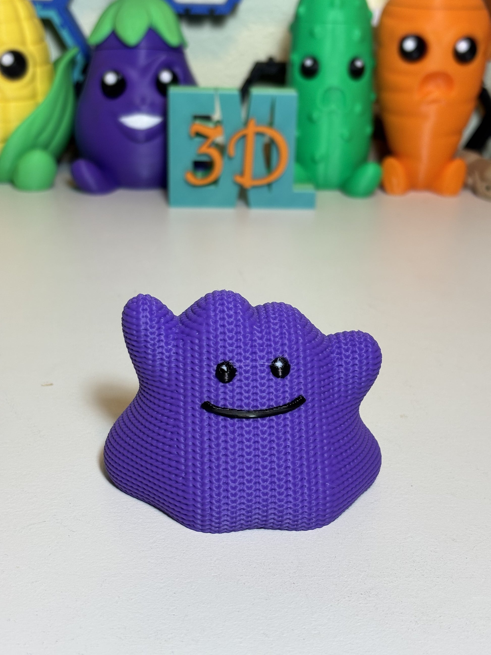 3D printed Ditto figurine from front angle against a neutral background