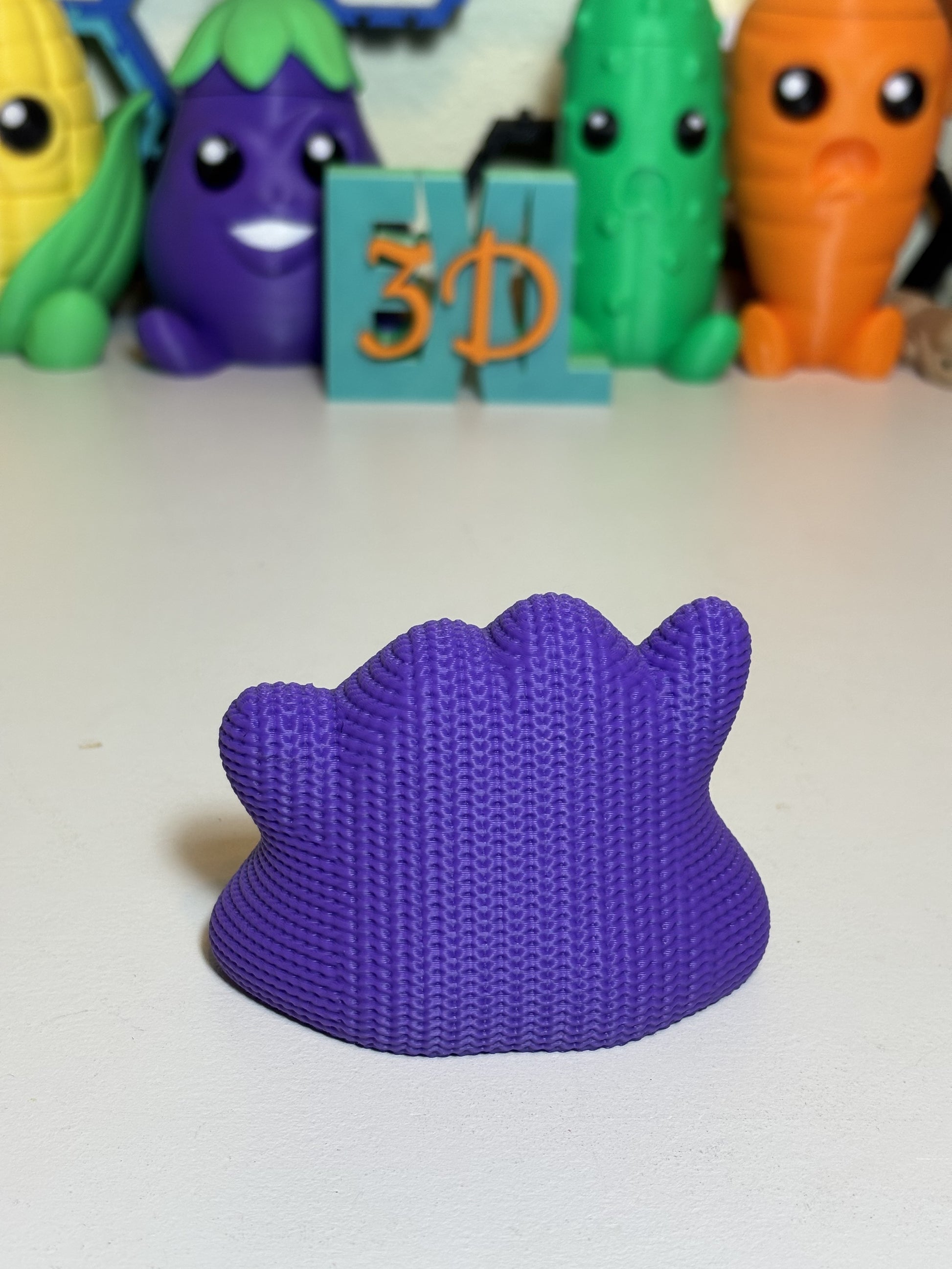 Side profile of 3D printed Ditto statue highlighting knit texture detail