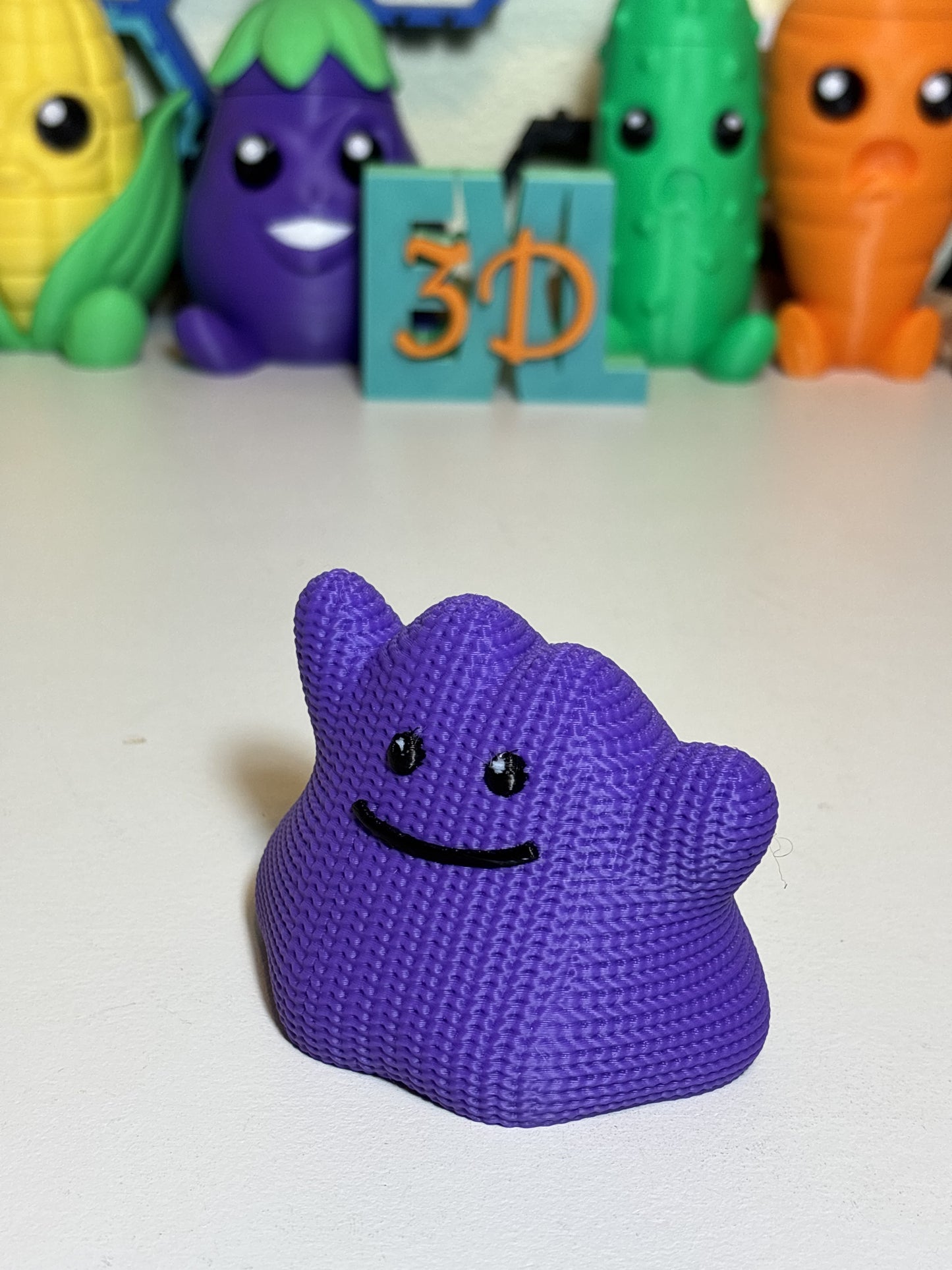 Faux knit texture 3D printed Ditto figure displayed on a wooden desk