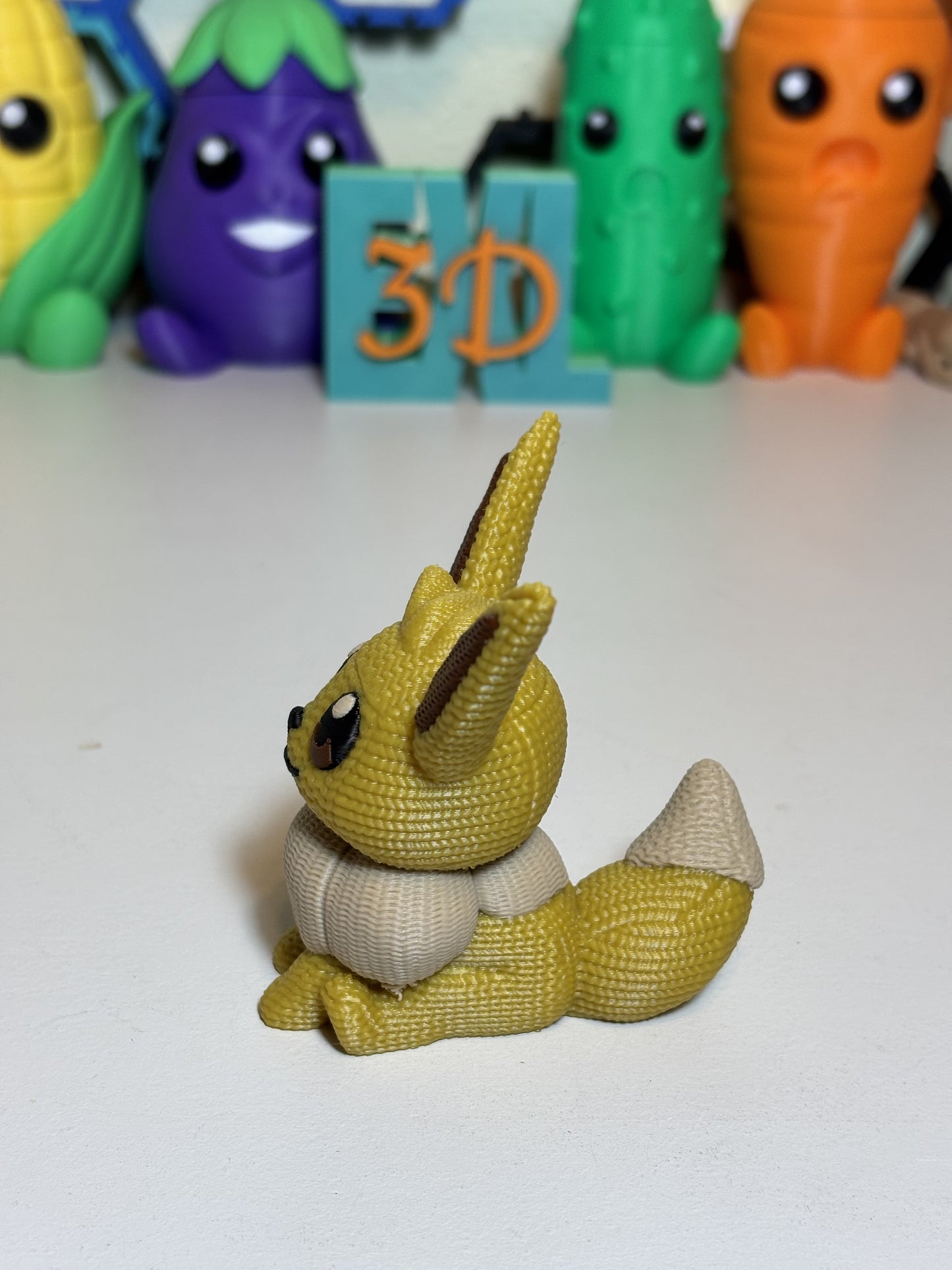 3D printed Eevee figurine side angle showing knit pattern detail
