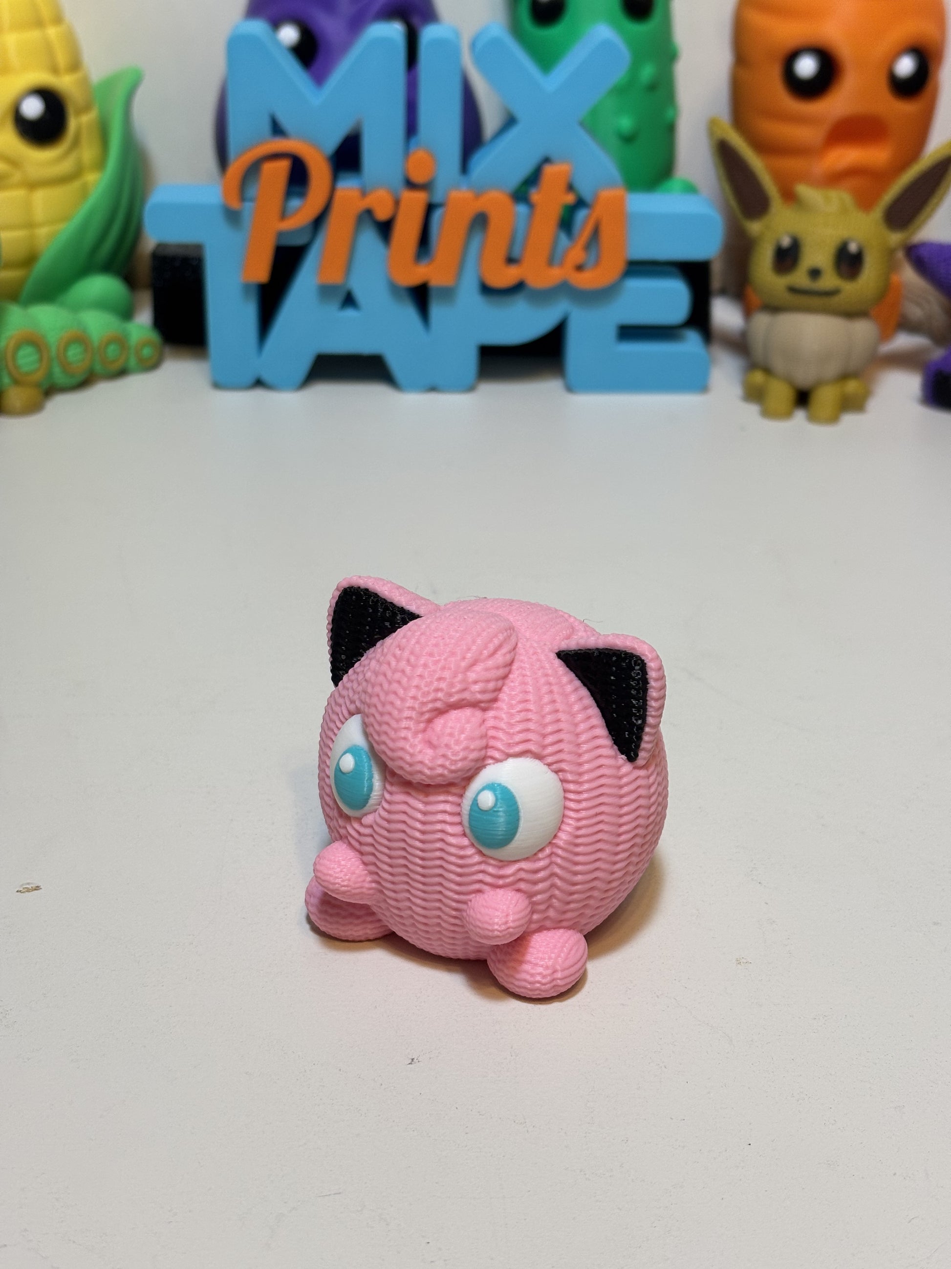 3D printed Jigglypuff figure with faux knit texture finish on white background