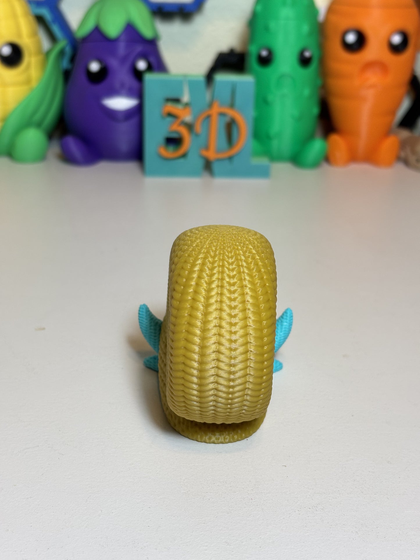 3D printed Omanyte sculpture shown from front angle on shelf decor