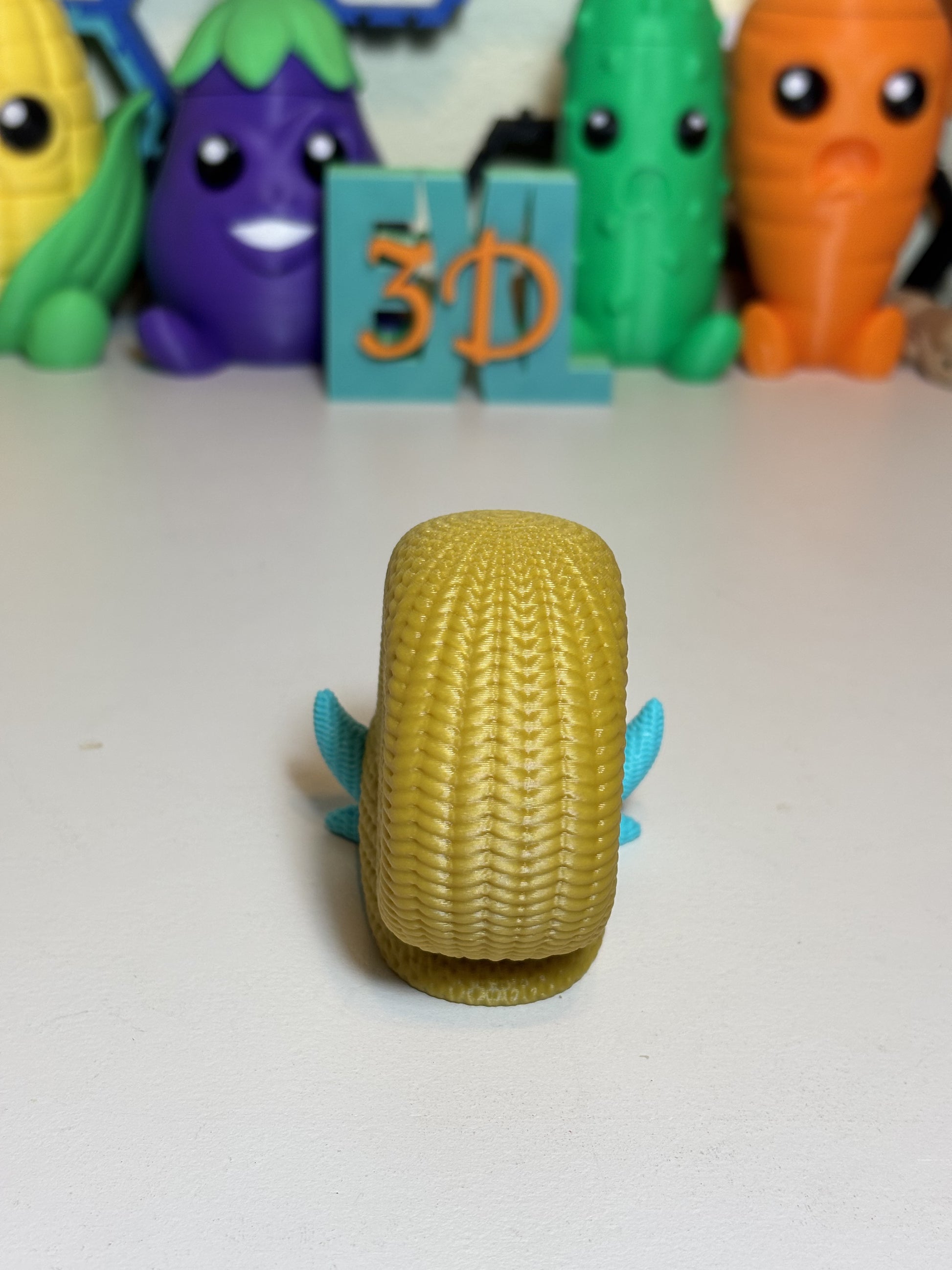 3D printed Omanyte sculpture shown from front angle on shelf decor