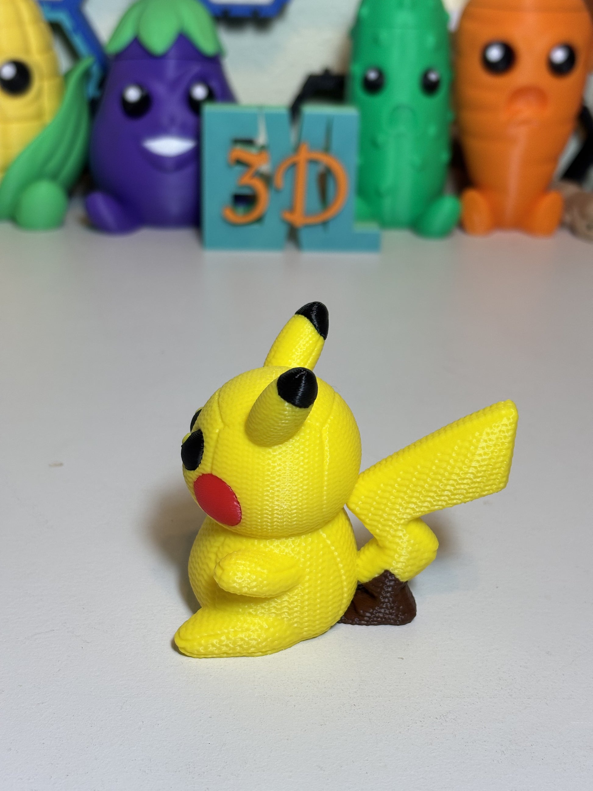 3D printed decorative Pikachu figurine displayed on bookshelf