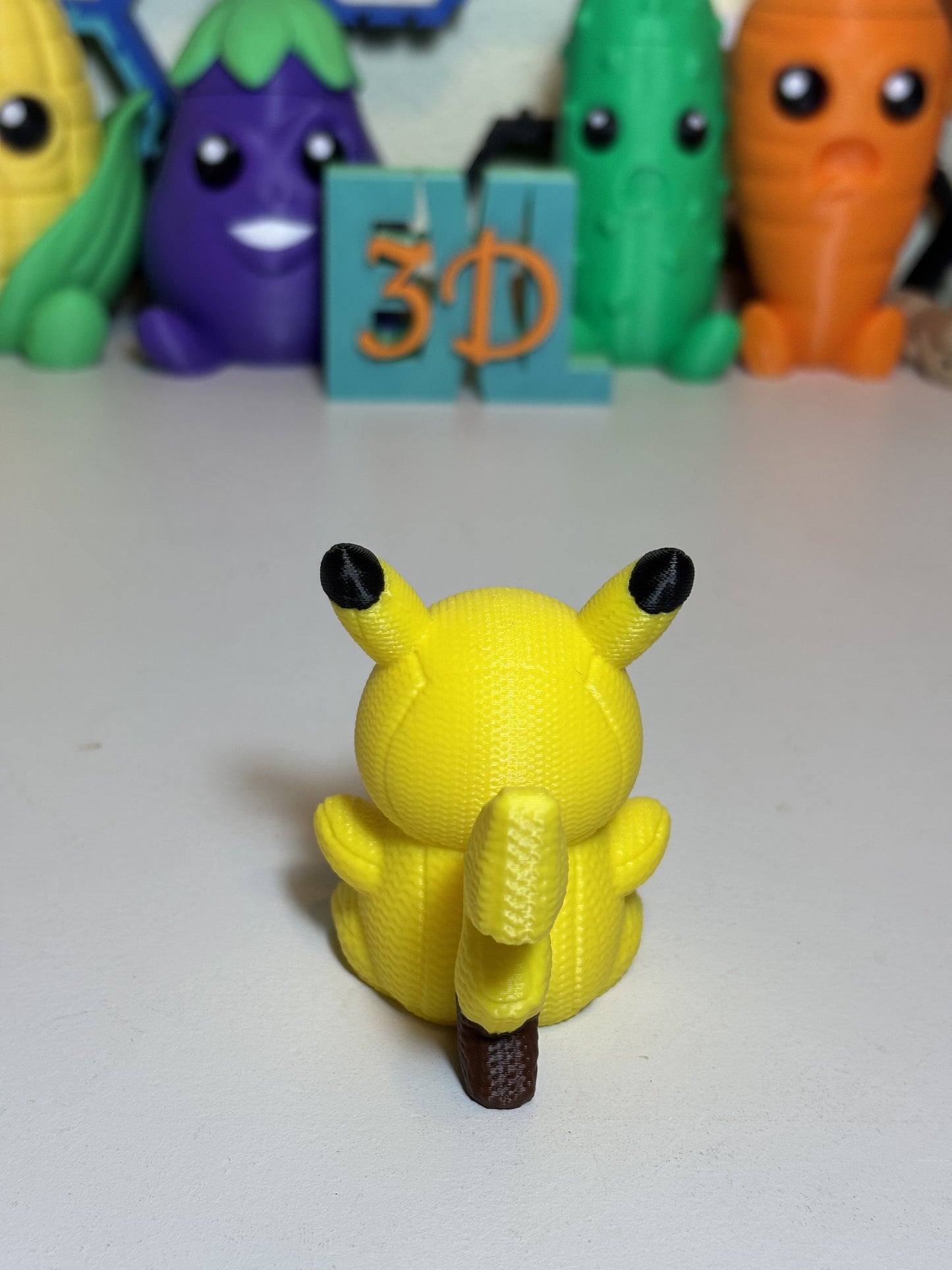 Faux knit Pikachu 3D printed sculpture gift angled side view