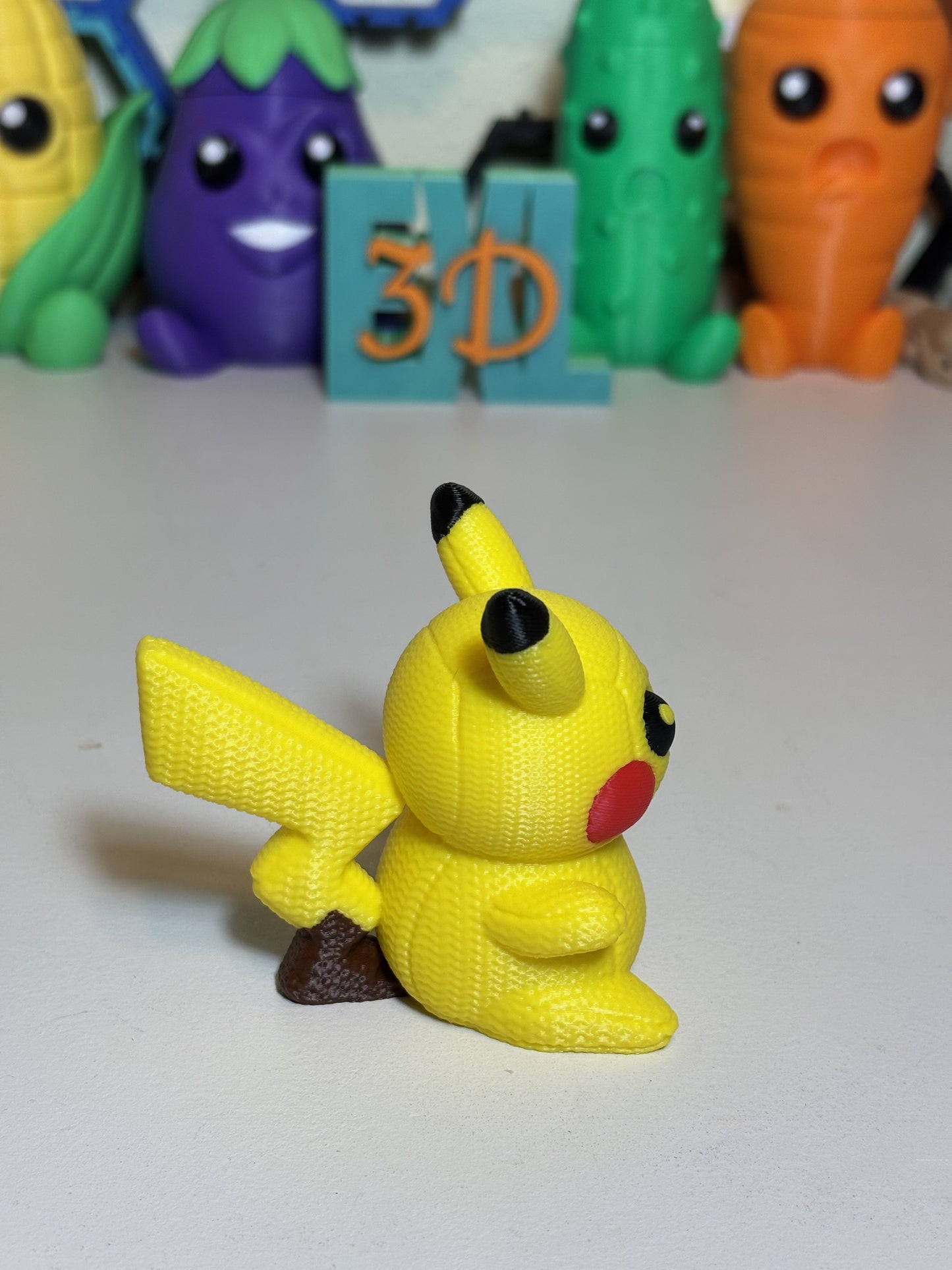 3D printed Pikachu statue showing full body faux knit finish