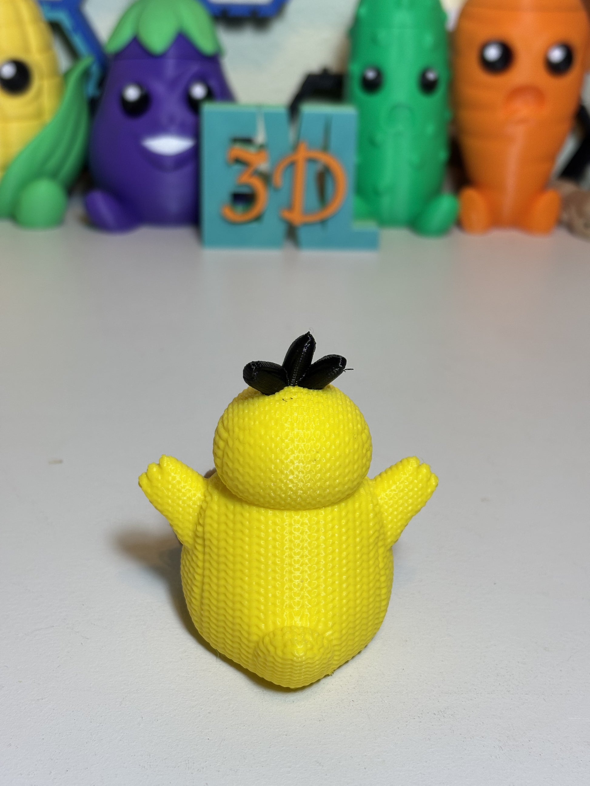 3D printed Psyduck sculpture gift displayed on shelf with plants