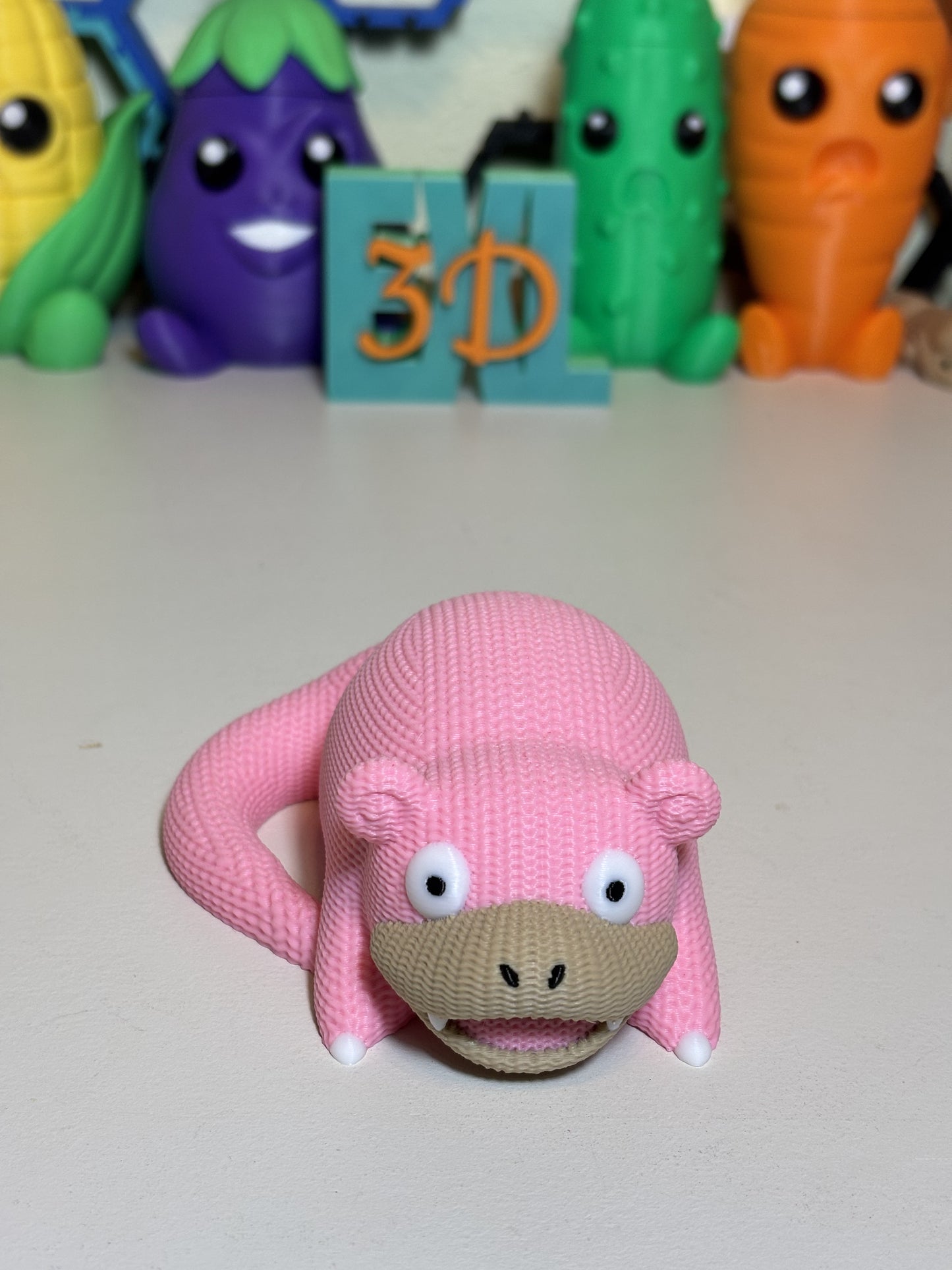 Faux knit SlowPoke statue displayed on shelf among pop culture decor