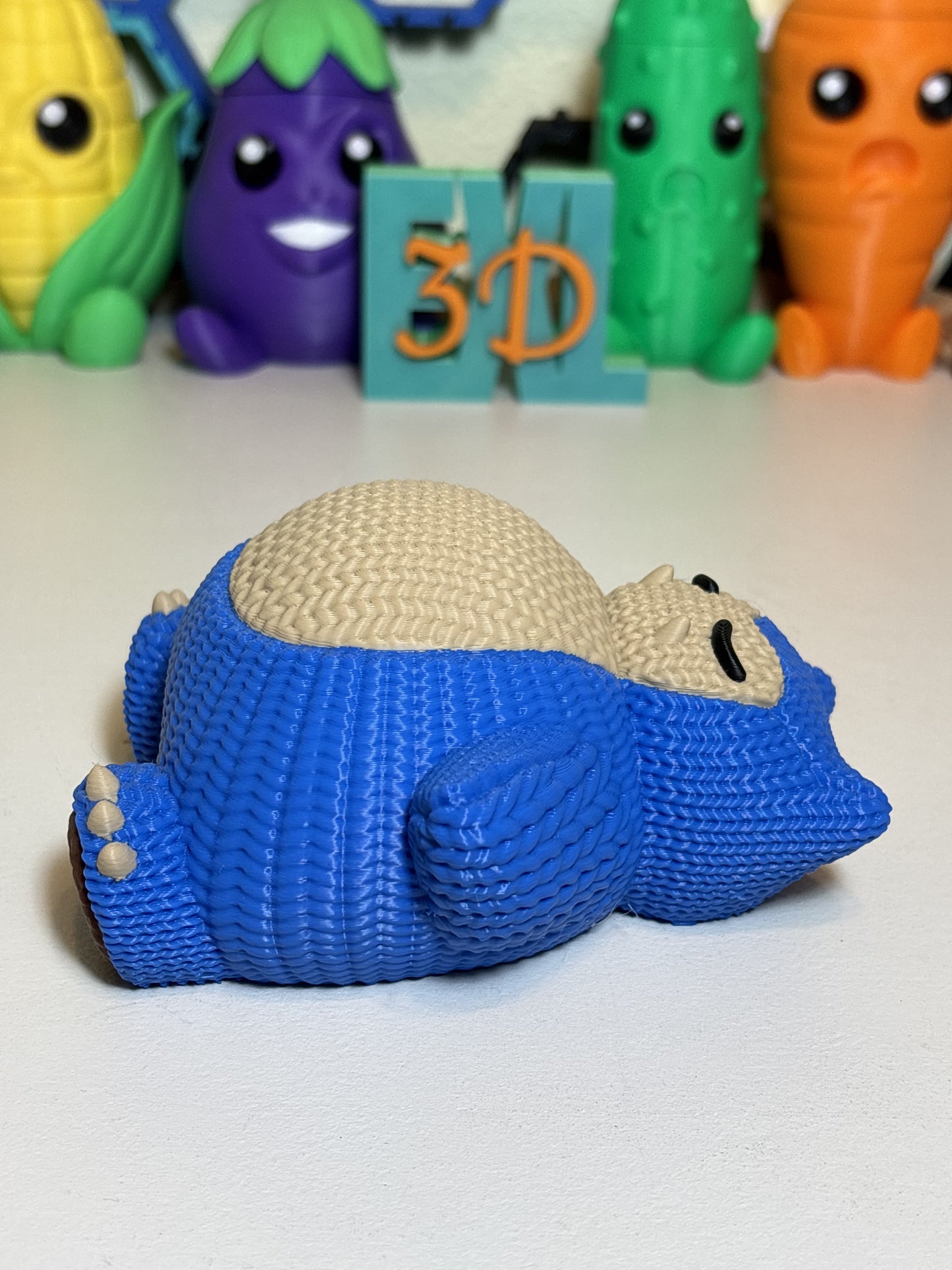 3D printed Snorlax sculpture displayed as gaming room shelf decor